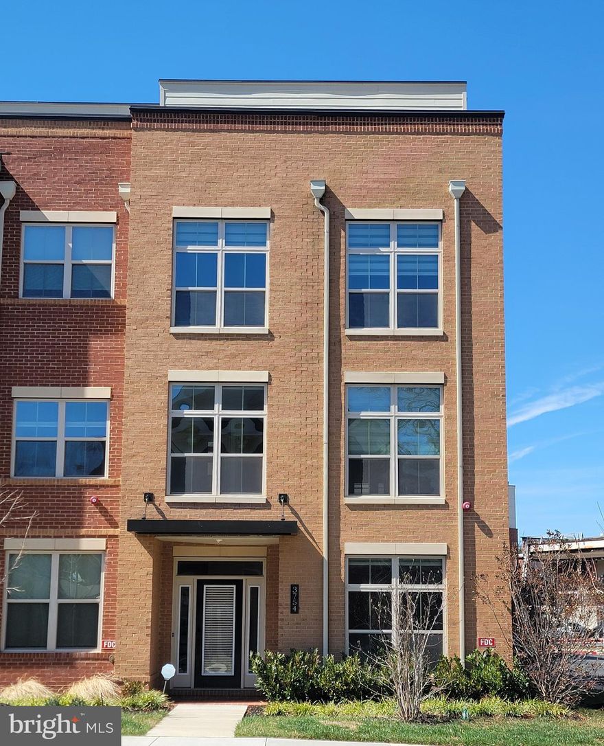 GREAT LOCATION!     Luxury  Brick Front , 4 Bed Rm, 4 Full & 1 Half Bath End-Unit Townhome  is in One of the Most Sought-After  Areas  of Fairfax City.   This  Stunning 4 Level  Unit has 2 Car Garage & two Balconies.    Gourmet Kitchen w/ Stainless Steel Appliances, Farmhouse Sink  & Soft-Close Cabinetry.   Huge Center Island w/ Upgraded Silestone Quartz Countertops.   Kitchen/Dining Leading out to Private    Covered Patio w/  Upgraded Wall Fireplace.   Impressive  Open & Modern Living Rm & Souring Ceilings   is included in this Home that Boasts over $20,000 in Upgrades.     Upstairs is  the Luxurious Owner's Suite w/ Tray Ceilings, Two Huge Walk-In Closets & Luxurious  En-Suite Bath w/ Silestone Quartz Countertops, Glass-Enclosed Shower & Upgraded Soaking Tub.     Generously Sized Two Other Bedrooms  & Baths.    Fourth Level has a Recreation Room,  4th Bedroom w/ Walk-In Closet & Full Bath.  Rec Rm  w/ Walk-Out to Rooftop Terrace.    Conveniently located to Shopping , Dining,  Entertainment, Schools,  Parks,  Major Commuter Routes, a Metro Station & Washington DC.       MUST SEE!