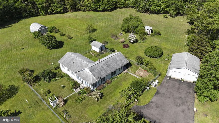 Tranquility at its finest! Looking for a peaceful home or a weekend getaway? This one-family home on a beautiful 10 acre lot is sure to wow! Located at the top of the road and surrounded by trees, this home is out of sight with no neighbors to see. Nearly 4 acres of the lot is cleared for you to enjoy the land and hang outdoors. The rest of the wooded areas are perfect for hunting. The home home features 3 bedrooms, 2 full baths, and an additional room that could be used as an office or 4th bedroom. Gather in the formal dining area for special moments, get cozy and relax by the gas stove in the living room, or enjoy your morning coffee while sitting in the screened in sunroom. There are also 3 storage buildings outside and an oversized detached 2-car garage with ample space for a workshop or additional storage.