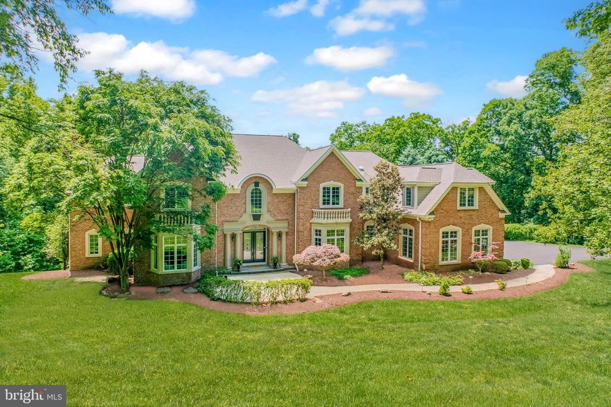 An estate home of quiet distinction, this Beacon Hill residence welcomes as airy vistas, architectural moments, three wooded acres unfold with everyday ease and lush outdoor entertaining. Recently refreshed with a fifty-year architectural roof, modern hues, and new driveway, the home’s 10,888 square feet are designed with intention, as sun-filled windows add views to your flowing floorplan, where polished stone and hardwoods define places to gather, dine, and create best-loved meals. In your gourmet kitchen, prepare weeknight favorites while overlooking the grounds with the help of custom cabinetry, high-end appliances, and butler’s pantry, while the stone-topped island hosts quiet coffee, Sunday brunch selections for the breakfast nook, and last-minute study breaks. Serve special occasions in the dining room, al-fresco gatherings beneath café lights, or simply take a favorite glass of cheer overlooking the Infinity-edge pool. Before heading to bed, youngest guests may offer one last wave from the mezzanine before being tucked into one of three bedrooms with en-suite baths. While two additional en-suite bonus spaces allow you to imagine morning yoga, spaces for creativity, or retreats for overnight guests. On the main level, days close into evenings soothed by your primary escape fireplace, nook for quiet inspiration, dual closets, and soothing oversized bath. While on tour, envision lively afternoons unfolding in the second-floor loft, while the lower-level invites wellness sessions in the professional gym, spirited evenings around the wet bar, and unforgettable gatherings that carry seamlessly from holiday celebrations to weekend entertaining. Sited within scenic trail-lined Beacon Hill, home is moments from Historic Leesburg shop and dining destinations, while routes lead towards idyllic Horse and Wine Country adventure, convenience for commuters, Dulles International Airport, and day trips beyond.

Cameras on property that record video and audio