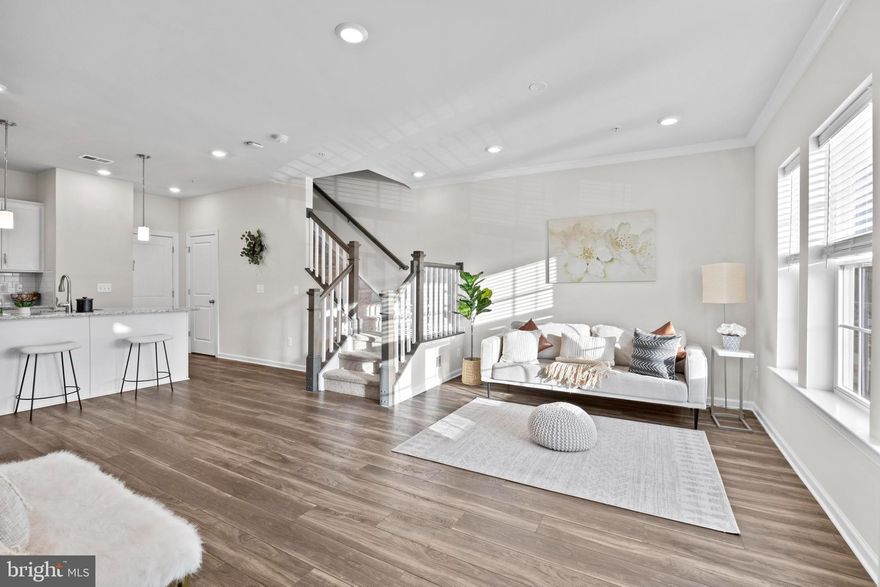 Step into modern comfort with this beautifully designed condo featuring an open-concept main level perfect for entertaining and everyday living. The stylish kitchen is equipped with stainless steel appliances, granite countertops, a large center island, and sleek luxury plank flooring that flows throughout the space. A convenient half bath and direct access to the one-car garage complete the main level.

Upstairs, you’ll find three well-appointed bedrooms, including a generous owner’s suite with a spa-like private bathroom. One of the secondary bedrooms opens to a charming balcony—ideal for morning coffee or evening relaxation. The washer and dryer are thoughtfully located on the bedroom level for ultimate convenience.

Enjoy resort-style living with the clubhouse, community pool, playground, and multiple sports courts just steps away. Commuters will love the unbeatable location with quick access to Rt. 340, I-270, I-70, and Rt. 15. This home truly has it all—schedule your private tour today and see it for yourself!