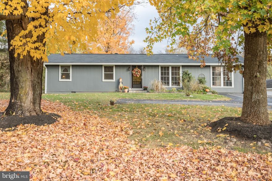 This one level home is situated on approximately one acre and offers a great commuter location that is convenient to I-66. as well as having  everything you desire to be nearby. . The setting of this well cared for home overlooks pasture land that is currently a horse farm. The home offers lots of natural lighting  throughout. The kitchen was remodeled in 2022 and features gorgeous white cabinets, quartz countertops with an island/bar area, stainless steel appliances & Ceramic tile flooring.   A  full bath was remodeled in 2020 and has a soaking tub to relax after a busy day and has a beautiful marble vanity top and ceramic tile tub area & flooring. The home has hardwood floors, recessed lighting, skylight, two fireplaces (one with built-ins in the family room), a large deck to enjoy having cookouts with family and friends.  The detached garage in the rear of the property has electricity, water and additional storage space. Many new updates installed in 2019 are: roof, vent collars, flashing, insulation in the crawl space, hot water heater, water conditioner,  smoke detectors, attic fan, septic distribution box, conveyance line(s), well cap & conduit. Also the  flue in the living room fireplace was cleaned & the heat shield was replaced..  Other updates  in 2020 are:: the ducts were cleaned & insulated and most of the electrical receptacles were replaced.  New guttering was installed in 2023. This home is move-in ready and awaits you and your family to enjoy the holidays  in your own home! All measurements are approx.
