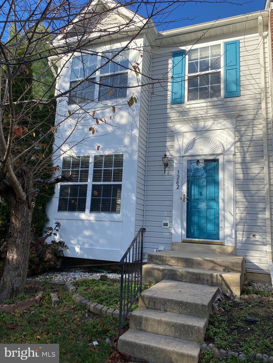 Enjoy HALCYON DAYS in your END UNIT townhome BACKING TO TREES! An open floor plan, hardwood floors flowing throughout, there is so much to love! Enjoy your kitchen with STAINLESS STEEL appliances and GRANITE countertops! MBR features VAULTED CEILING. The GROUND LEVEL WALKOUT BASEMENT with NEW floor takes you to a patio and fenced back yard. Neutral colors and ready for you now! SUPERB LOCATION!