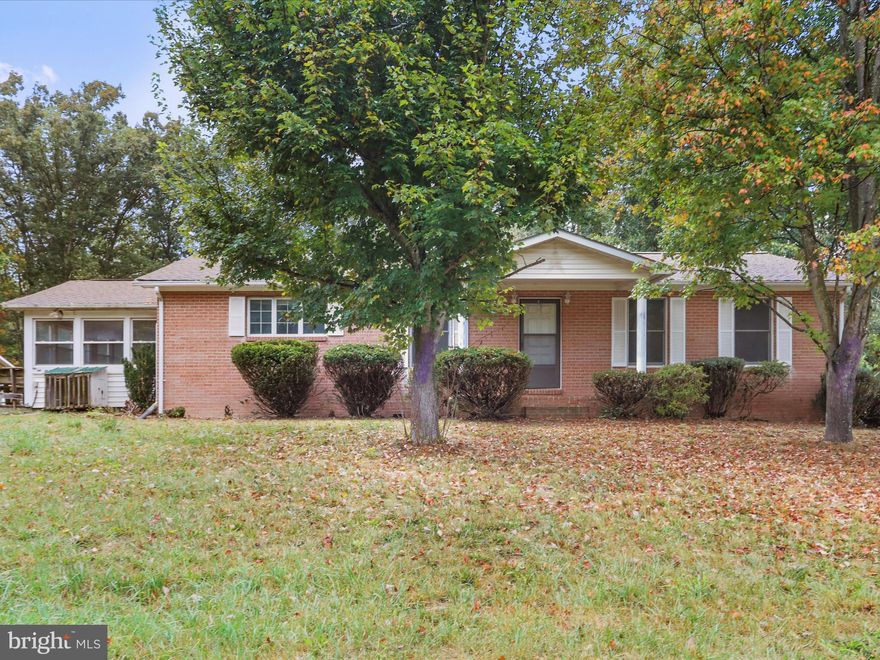 Country Freedom, Easy Commute, Tremendous Value. Escape the congestion and discover a property that gives you room to breathe. With just over 10 acres and minimal restrictions, this Hampshire County home offers the perfect balance of commuter convenience and country freedom. In under 40 minutes, you can be in Winchester, Virginia, yet when you’re here, you’ll feel a world away—surrounded by land, wildlife, and peace. The brick home features three bedrooms, one and a half baths, a welcoming living room with a fireplace, a sunroom with its own fireplace, and a full unfinished basement with a garage. Yes, it needs some updating, but that’s the opportunity—secure acreage, space, and location at a price point that leaves room for your vision and improvements. Outside, the amenities set this property apart: an oversized two-car detached garage, three sheds for storage or projects, a gazebo for relaxing, and a mix of open land and wooded cover that prior owners have enjoyed for hunting deer, turkey, and even the occasional bear.
Whether you’re relocating from Northern Virginia or Washington, D.C., for a quieter pace, seeking a weekend retreat, or investing in land with long-term potential, this property checks every box. Land, location, and lifestyle—here’s your chance to have all three.