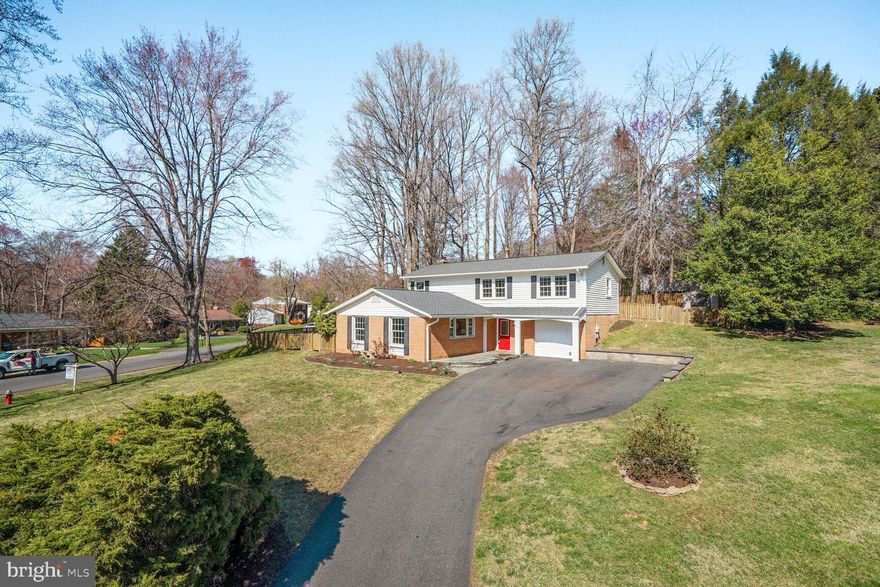 Welcome to Sutton Place, an elegant colonial offering over 2,135 square feet of beautifully finished living space, situated on a spacious half-acre lot in one of Fairfax's most coveted neighborhoods. This prime location provides easy access to Dunn Loring Metro and the vibrant Mosaic District, as well as top-rated schools including Woodson High, Frost Middle, and Mantua Elementary. The main level boasts gleaming hardwood floors throughout and a seamless flow between the open kitchen, living, and dining areas. The chef-inspired kitchen is equipped with skylights, stainless steel appliances, abundant cabinetry, silestone countertops, and a breakfast area. The dining and living areas feature crown molding, with a modern light fixture in the dining space, while the family room offers a stately brick fireplace as its focal point. Upstairs, you'll find four spacious bedrooms and two full baths, all with hardwood flooring. The expansive primary suite includes two closets and an en-suite bath with a separate vanity area. Step outside and enjoy the beautifully landscaped yard, offering plenty of space for relaxation and entertainment. The large half-acre lot features lots of green space, a fully fenced-in backyard, and well-designed hardscaping elements, including a retaining wall, a spacious patio area, and wood-burning fire pit, perfect for evenings with family and friends. Nestled on a tranquil street, this home is a “stone's throw” away from Eakin Park and the Gerry Connolly Cross County Trail, perfect for outdoor enthusiasts. With its perfect blend of space, comfort, and convenience, this home is ideally located near shopping, dining, and transportation options. Don’t miss your chance to experience this exceptional property!