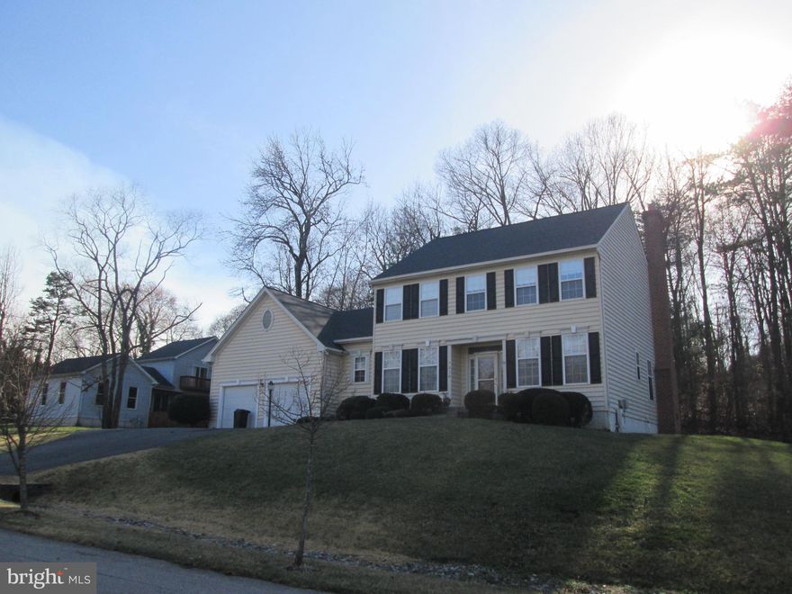 Welcome to 7810 Grandison Way, a spacious and well-appointed single-family home located in the intimate community of Grandison Purchase. This deceptively large home offers over 3,600 square feet of finished living space with 4 bedrooms and 3.5 bathrooms. The primary bedroom suite features a ceiling fan, and an en suite bathroom, and two walk in closets completely designed by Closets by Design. The main level boasts hardwood floors throughout the sitting room/office; dining room and family room which also has a cozy wood burning fireplace; there is also a large kitchen and laundry room. Step outside to enjoy the peaceful surroundings from the rear deck, which offers a private outdoor space. Gleaming hardwood flooring in the Living Room, Dining Room and Family Room The massive finished walk-out basement adds tremendous value, offering a large recreation area, and two additional rooms that can be used as a bedroom, hobby shop or office, as well as another full bathroom-perfect for guests or multi-generational living. Prime location across from Severn-Danza Park, less than 5 miles to Fort Meade, NSA, and NASA, and minutes to Arundel Mills, BWI Airport, Downtown Baltimore, Crofton, Maryland Live, Merriweather Post Pavilion, and major commuter routes. New garage doors with Chamberlain openers, auto close, battery backup and built in camera. New roof with architectural shingles (2022);French drain in backyard; sump pump replaced (2026); septic system cleaned (February 2026).