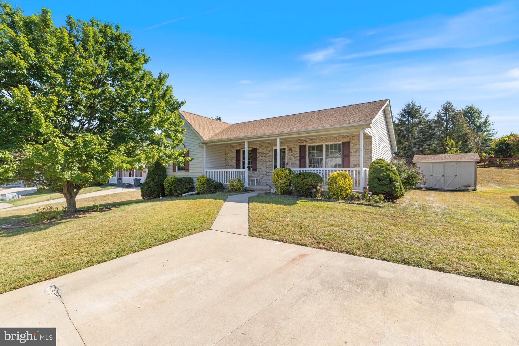 Beautifully maintained and move-in ready 3BR/2BA Rancher located on a cul de sac in the quiet neighborhood of Littlestown. Pull into the double wide driveway, pass by adult trees and a lush lawn on your way to the covered front porch of your forever home. Step inside a home filled with natural light, an open floor plan, luxury flooring and a soft color palette. The main living space offers a large living room, an open concept dining room and kitchen, first floor laundry, and a large family room with a vaulted ceiling. The kitchen features plenty of cabinets and counter space, a double sink under a window, and a movable island. Down the hall are two sizable secondary bedrooms, a larger primary bedroom, and a full bath. The lower level offers additional semi-finished living space with a powder room, an additional laundry hookup, storage, and a walk-up to a spacious yard. From the main floor step outside onto a wood deck that overlooks a yard filled with green space, adult trees, a shed, and so many possibilities. This home is move-in ready with so much to offer new homeowners and is located in close proximity to shopping, restaurants, and commuter routes.