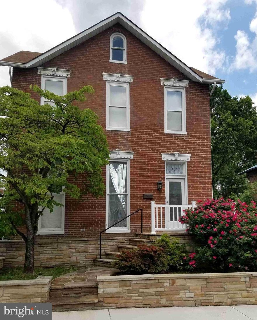 Charming historic all brick home neslted in Historic West Side of Cumerland and Mountain Side Maryland, as enter you are welcomed by a gracious open staircase,  built in 1890,  currently 2 units both occupied, leased month to month, simple to convert to single family home in Historic West Side, includes each floor 2 Bedroms, 1 baths, kitchens, also 2 garages,  plenty of storage, full basement, gas heat, walk up attic, some new  windows, no central air, outdoor patio,.  Current gross income $1,100.  Schedule your tour today.