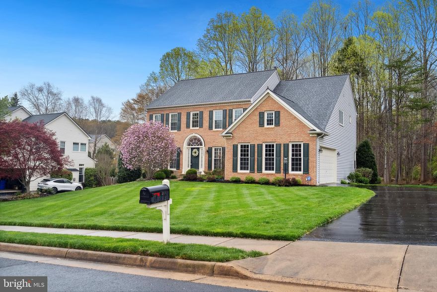 This exquisite residence is truly one of the most stunning homes in the area’s most sought-after neighborhood. Perfectly situated on a picturesque cul-de-sac, it offers a private, flat wooded backyard, creating an idyllic space for both peaceful retreats and entertaining. Inside, you'll find fully remodeled, top-of-the-line bathrooms and brand-new windows along the front and side elevations. The home exudes timeless charm with elegant moldings and intricate millwork throughout, complementing its exceptional craftsmanship. Flanking the grand two-story foyer, the formal Living and Dining rooms provide an impressive entrance, while gleaming hardwood floors extend throughout. The kitchen is a chef’s dream, featuring new stainless steel appliances—including a refrigerator, built-in microwave, and double wall oven—and seamlessly opens to a spacious deck and a charming screened-in gazebo, perfect for enjoying quiet, comfortable evenings. The inviting two-story family room, centered around a gas fireplace, creates a cozy and warm atmosphere. A generously sized bedroom with a full bath on the main level offers versatile living options. Upstairs, the expansive primary suite boasts large walk-in closets and a luxurious, fully renovated en-suite bath complete with a soaking tub and a separate glass-enclosed shower, featuring elegant tile inlay. Three additional bedrooms and an updated full bath complete the upper level. The bright, walk-out basement is an entertainer’s dream, offering space for a pre-wired media room, an exercise room, a full bath, plentiful storage, and a large open area perfect for games, hobbies, or gatherings. Impeccably maintained and brimming with character, this home also features a side-entry two-car garage. Outdoor storage is never a problem as this home has a built-in shed under the deck. New furnace and water heater in 2022 and newer roof. This is an extraordinary opportunity to own one of the finest properties in the neighborhood—don’t let it pass you by.