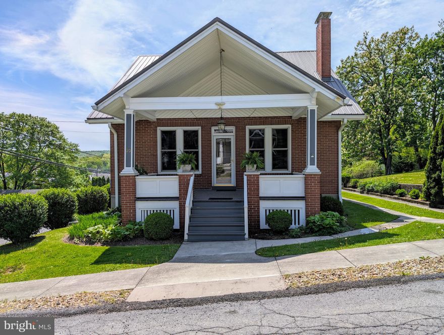 If you're looking for the ease of town living, but space enough for a yard, you've found your home. Located at 20 West 2nd Street in the great town of Everett sits a brick and vinyl cape cod that will wow you. This home has been meticulously cared for! Pristine oak and tile floors throughout entire home, and cherry built-ins give this home the warmth it deserves. A large covered front porch invites you into a cathedral ceiling of beautifully crafted wood. Three large ceiling fans to keep the air moving in any season, there's also a brick, wood burning fireplace to sit around when the air turns chilly. Original stained glass is the Devroe crest, that ordains the two side windows of the fireplace and haven't moved since their inception. They're a remarkable addition to the cherry built ins that surround the fireplace. Beveled windows throughout are also found on the french doors that open into the dining area. Glass door knobs are the exact character this home needs! A stately tiffany style chandlier hangs from the ceiling while custom blinds and valances sit atop bench built ins for added storage. Plenty of room in the kitchen for cooking and entertaining! The bar can accommodate high top chairs and overlook the kitchen. Black appliances look nice against the cherry stained oak, more custom blinds and valances and a newer garbage disposal. A garage door signal is located in the kitchen so you know if you accidentally left the garage door open! Step out onto the screened in 3 season room that also has an outdoor pantry. Off of the screened in porch is access to the terrace on top of the garage. Proper railing has been installed. Fill this with foliage and flowers and let it be your oasis! Back inside the home the first level offers a main bedroom with closet and its own french doors with access to the 3 season room. The main full bath carries on the cherry cabinets along with custom blinds, valance and shower curtain. Clean and impeccable!
A beautiful oak staircase will lead you to the two bedrooms that each have an alcove that overlook the back yard. All bedrooms with ceiling fans, closets, and the original oak floors. Second story full bath continues with the cherry cabinetry, tile floor, a Jacuzzi tub and stall shower. Laundry tubs and laundry area are located in the basement. A cedar closet, tons of storage area, a half bath and access to the integral garage that will fit one large vehicle or two smaller ones.  A new metal roof with 50 year warranty installed 2022; newer garage door, 2023 the front and back porch were painted and carpeted, and 2022 new water heater. Mature landscaping and ease of entry whether the front, side, back or through garage give you the access you need. This home is close to all the wonderful amenities that Everett has to offer. From walking distance to shops, eateries, gas and groceries, a library, banks, a barber shop, beauty shops, and doctors. Quiet and friendly neighbors are pivotal to loving your neighborhood and home and you will find that right here in the heart of 20 West 2nd Street, so schedule your tour today!