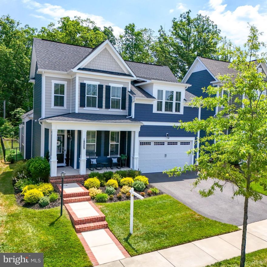 Welcome to your dream home! This GORGEOUS 4-bedroom, 4.5-bath home features the PRIMARY BEDROOM SUITE on the MAIN LEVEL, designed with comfort and luxury in mind. The main level boasts wide plank luxury laminate flooring and soaring vaulted ceilings. You'll find an office, powder room, and a gourmet kitchen and dining room with exquisite upgrades, including stunning chandeliers and pendant lights. The kitchen is a chef's delight with a stainless steel appliance package, remotely controlled oven, quartz countertops, center island, soft-close drawers and cabinetry, under-the-counter lighting, and a custom backsplash. The great room is perfect for cozy evenings with a gas fireplace and a sliding glass door that leads out to a beautiful stamped concrete patio, a flat backyard, and a serene treelined view. The primary bedroom suite is spacious and airy, featuring two custom closets and a spa-like bath. Conveniently, the laundry room is located on the main level just off the garage and includes a new utility sink. Upstairs, you'll find three additional bedrooms and two full baths, providing ample space for family and guests. The lower level offers a finished recreation room with a wet bar rough-in and additional spaces that you can customize to your liking. The unfinished areas can become a legal fifth bedroom with window egress, a theater room, a dedicated workout area, or extra storage. From the lower level, walk up and out to the amazing FLAT BACKYARD! This backyard is fenced and includes a dedicated dog elimination area with artificial turf, perfect for pet owners. The backyard and patio receive morning sun and afternoon shade, making it an ideal spot to relax throughout the day.  Both the front and backyard are equipped with an inground sprinkler system, and the 2-car garage features a finished epoxy floor. This smart home includes a doorbell camera, motion sensors on doors, a thermostat, and kitchen lights that can be controlled remotely by a phone app.  There is also an indoor fire suppression system. Beyond the home's impressive features, the HOA fee ($180) INCLUDES high-speed internet, trash, and access to an array of world-class amenities, including fitness facilities, a Jack Nicklaus Signature Public Golf Course, swimming pools, multi-purpose courts, 9+ miles of wooded trails with a trail head steps away from the front door, and more! Exciting future plans for the community include a planned VRE station and Town Center.  This home is conveniently located near Potomac Shores Middle School, John Paul the Great High School, and the Ali Krieger Sports Complex. Don't miss the opportunity to make this your dream home in Potomac Shores!