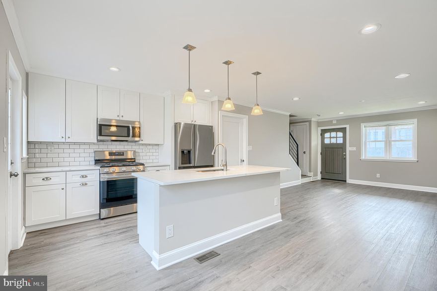 Rarely available 17-foot-wide, newly renovated 3BR/2BA home offering quality craftsmanship and a spacious layout. The open main level flows seamlessly from the living area into a gourmet kitchen with a large island and dining space - ideal for entertaining. Upstairs you'll find three generously sized bedrooms with custom closets and a beautifully updated full bath. The finished lower level provides additional living space, a second full bath, and walk-out access to a rear patio and fully fenced yard. This home delivers space, style, and functionality in one package.