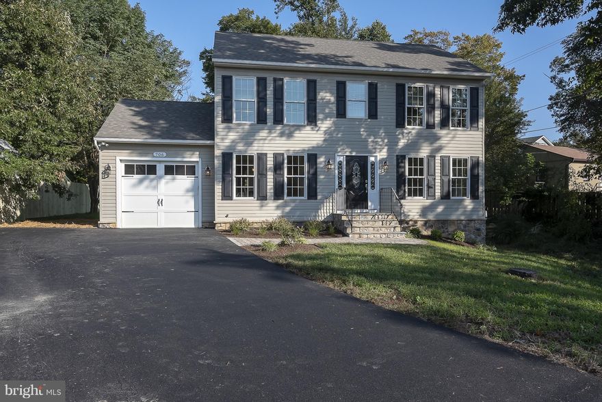 Put your toes in the Sand and a drink in your hand.  Newly rehabbed Large colonial with 4 bedrooms and 2.5 baths,  Hard to find BASEMENT and 1 car garage. Large open floor plan.  Home has just been freshly painted, new carpet, landscaping, etc.  Basement has rough in for bathroom.   Main level has hardwood floors throughout.  Kitchen has new granite counters, stainless steel appliances and breakfast nook.  Spacious family room has gas fireplace.  You also have a Separate dining room & living room or office. Master Bedroom has a walk in closet,  another separate closet and vaulted ceiling.  En suite has a separate shower and jacuzzi tub.  Come down to the Awesome beach and swim in the roped off swimming area, Check out the play ground or just relax while enjoying the view of the Chesapeake Bay.  There's a Marina and boat ramp too.  Blue Ribbon Schools!  Neighborhood does 4th of July parade and picnic, Halloween costume party and parade, Yoga on the Beach, etc.  Easy commute to DC, NSA, Baltimore and Annapolis.