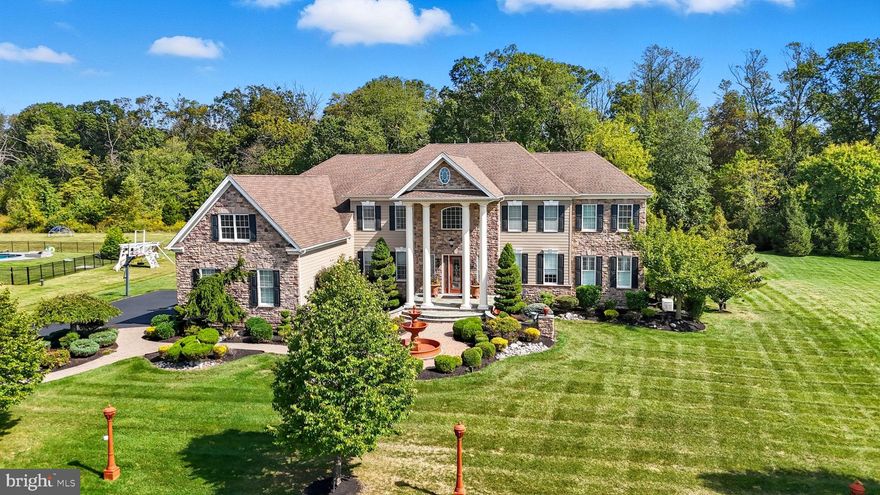 Welcome to this exceptional 5-bedroom, 4.5-bath estate, offering 6,584 square feet of luxurious living space, located on a quiet cul-de-sac in the coveted Chapman’s Corner community. Built in 2013 by Toll Brothers, this Henley Versailles model home features over $400,000 in premium upgrades, exquisite architectural details, and high-end finishes throughout.

A dramatic two-story foyer with dual curved staircases sets the tone for elegance and grandeur. Soaring 10-foot ceilings on the main level and 9-foot ceilings upstairs create an open, airy feel, complemented by oversized windows and custom millwork. Beautiful custom hardwood and tile flooring though out, including ceramic medallion in center of the foyer. The spacious two-story great room includes a striking 2 story stone fireplace, stunning “Coffered” ceiling, and flows beautifully into the heart of the home: a chef’s kitchen featuring rich wood cabinetry, granite countertops, a large center island, reverse osmosis water filter, subzero and professional-grade stainless steel appliances, walk-in pantry closet. The rear of the home was expanded during construction, to be even more spacious!

Retreat to the luxurious primary suite offering a bonus sitting room/office ,  3  walk-in closets, dual toilets, dual vanities, an ultra shower, and a whirlpool soaking tub. Off the primary bedroom is another huge bonus room. The four additional bedrooms include an en-suite and a Jack & Jill layouts, offering privacy and comfort for family or guests. A fifth bedroom or optional office/playroom provides flexible living space that features extra storage closet with built in cabinetry.

Designed for both work and play, the main level includes a dedicated office with custom built-in shelving, a gym/playroom, and a bright, window-lined conservatory. The custom 4-car garage features built-in shelving, cabinets for storage, and a specialized floor system - perfect for the car enthusiast or extra storage. A full basement provides endless possibilities, with high ceilings, rough-in plumbing for full bathroom, enabling future expansion. Walkout stairs provide added light and convenience.

Additional highlights include a whole-house generator, expansive private backyard, custom designed front hardscape walkway with special features including large decorative water fountain, artistic post lighting and additional accent lighting.  This home features full home security system with exterior cameras, and fire sprinkler system. This is an award-winning location in the Council Rock School District with an easy commute to Philadelphia, truly offering the perfect balance of luxury, space, and convenience. The lot boasts one of the best locations in “Chapman’s Corner,” a quiet cul de sac with expansive Bucks County views.