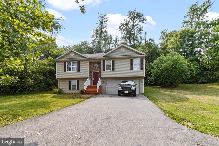 Home sits on almost one acre! 3 bedrooms, 2 baths, kitchen with stainless steel appliances, dining area and large living room with gas fireplace. Fully finished lower level offers large family room, laundry area and half bath. 2 car garage. Rear deck.