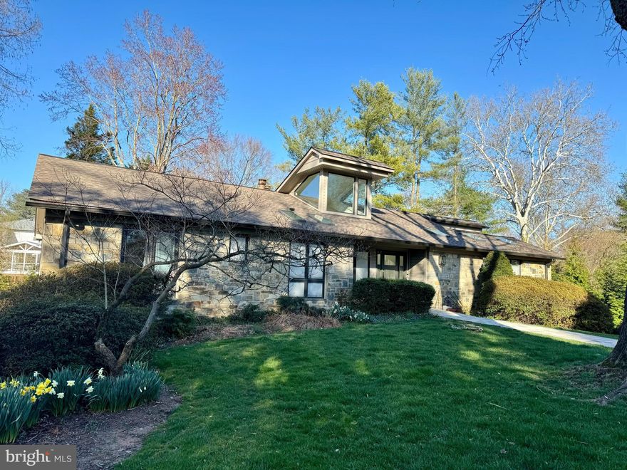 Stunning presentation of this modern style house with renovated kitchen and baths * Sited on a cul de sac on a large beautifully landscaped lot with a private backyard with flagstone patio, hot tub and koi pond with water feature * Sensational kitchen with vaulted ceiling, custom Italian cabinets and huge waterfall quartz center island, Miele stainless steel appliances including built-in coffee maker * Built-in banquette in the breakfast nook * Dramatic pavilion  style family room with a butterfly ceiling and floor to ceiling stone fireplace and walls of windows * Owner's suite with large walk-in closet and luxury bath with steam shower * Three additional bedrooms with two renovated baths * Walkout lower level with rec room with gas fireplace and walls of windows and glass doors to back patio, study with built-ins, exercise room with garden views and spacious garage with new glass garage door * Light filled rooms throughout with garden views from every room *