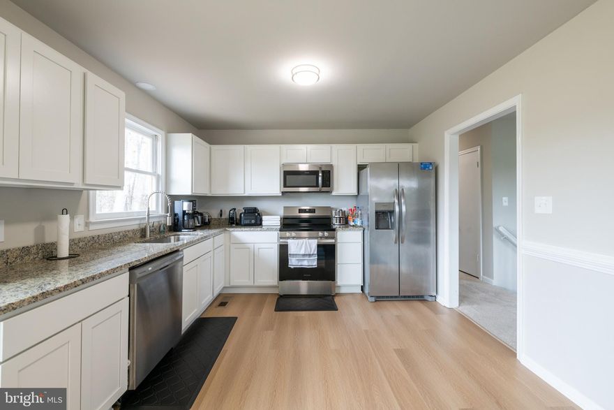 Motivated seller! Open house Saturday 11:00 AM-3:00 PM and Sunday 12:00-2:00 PM! Ask about incentives!! Located at 19096 Partlow Road in Beaverdam, Virginia, this meticulously renovated split foyer home offers a harmonious blend of modern updates and serene country living. The property features 3 bedrooms and 2 full bathrooms, with a spacious interior spanning approximately 1,700 square feet. The home boasts a bright and spacious living room, enhanced by new luxury vinyl plank flooring and plush carpeting throughout. The kitchen is equipped with brand-new appliances, sleek cabinetry, and elegant granite countertops, providing a modern and functional space for cooking and entertaining. Adjacent to the kitchen, the dining area offers access to a newly constructed deck, ideal for enjoying morning coffee or hosting gatherings. The upper level includes two spacious bedrooms and a full bathroom, all featuring new vanities and flooring. The lower level offers an additional bedroom, another updated full bathroom, and a generous recreation/family room, ensuring comfort and convenience for family members and guests. The home is equipped with a new HVAC system, ensuring year-round comfort. A new sliding door invites natural light into the living spaces, enhancing the home's bright and airy atmosphere. Expansive Lot: Situated on a beautiful 2-acre lot, the property offers a peaceful countryside setting, providing a tranquil retreat from urban life. This property combines modern amenities with the tranquility of rural living, making it an ideal choice for those seeking a comfortable and updated home in a serene environment.