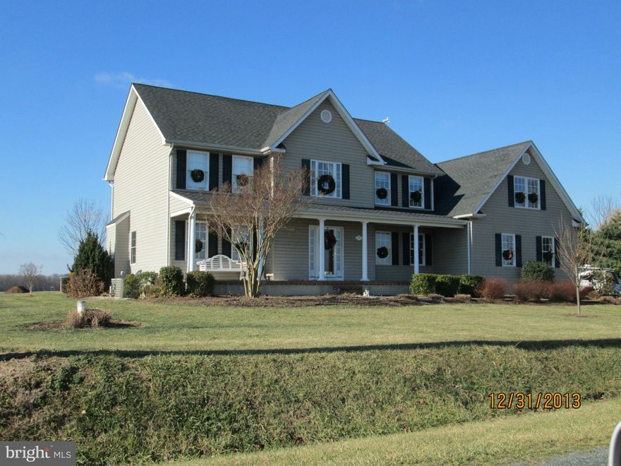 Fantastic opportunity; this home offers the finest of country living.  Huge 5 bedroom home, office space on the lower level, over sized 2 car garage, one acre, beautifully landscaped); rear screened porch, large rear deck, fire pit, invisible fence for pets. Huge eat in country kitchen, professional office on upper level, Gas heat!