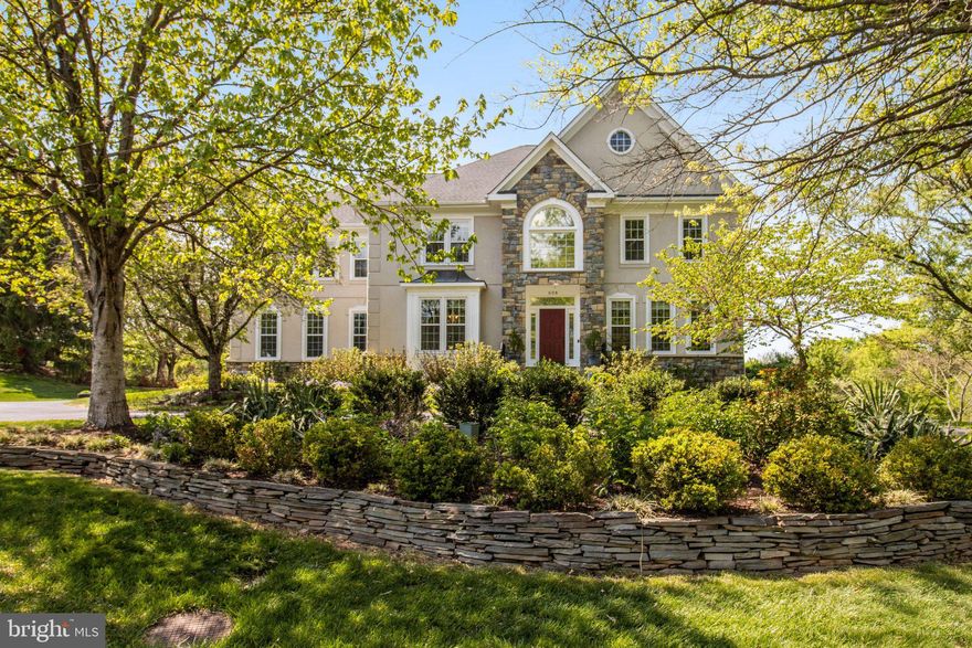 Nestled within the prestigious Ridings of Great Falls, this exceptional Renaissance-built Colonial offers a rare blend of timeless elegance, modern upgrades, and resort-style living on 1.72 private acres. This meticulously maintained estate delivers over 7,000 square feet of refined living space designed for both grand entertaining and everyday comfort.

A striking stone and stucco exterior sets the tone, while inside, a dramatic two-story foyer and soaring family room welcome you with abundant natural light, rich hardwood flooring, and a graceful spiral staircase. The thoughtfully designed layout flows seamlessly into a chef’s gourmet kitchen, fully renovated and equipped with high-end cabinets, updated cooktop, double ovens, an oversized island, and a butler’s pantry—perfect for effortless hosting.

The main level features elegant office, formal living and dining room, along with a sunlit breakfast area overlooking beautifully landscaped grounds. The inviting family room, centered around a dual-function fireplace, creates a warm yet sophisticated atmosphere.

Upstairs, four generously sized bedrooms and three bathrooms include a luxurious primary suite with large sitting room, featureing a gas fireplace, beautiful tree and garden views from large windows, offering a spa-inspired retreat. The fully finished walkout lower level expands the living space with a large sunroom, custom theater, gym, 5th bedroom and full bathroom, additional fireplace, and versatile recreation areas.

Step outside to your private oasis—an expansive, tree-lined backyard featuring a resurfaced resort-style pool, spacious deck, and stone patio, all surrounded by professionally designed landscaping. Whether entertaining or unwinding, this outdoor setting offers unmatched privacy and tranquility.

Extensively updated over the years, this home showcases pride of ownership with major improvements including a fully renovated kitchen, updated bathrooms, new windows, HVAC systems, landscaping, pool enhancements, and fresh interior and exterior refresh in 2026.

Additional highlights include a three-car side-entry garage, energy-efficient systems, underground irrigation, and a prime location just minutes from major commuter routes and less than 10 miles to the airport.

This is more than a home—it is a statement of lifestyle, where luxury, comfort, and exclusivity converge in one of Great Falls’ most sought-after communities.