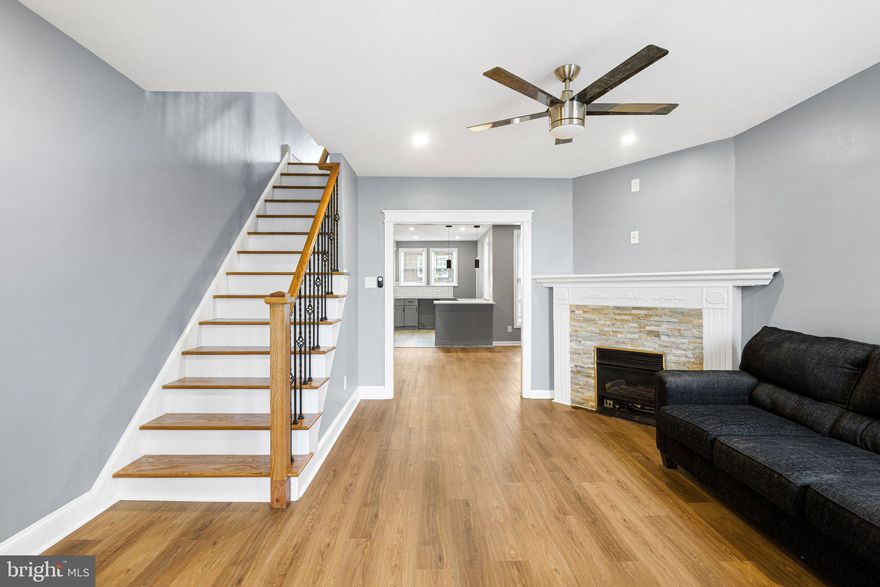 Step into this beautifully renovated 3-4 bedroom, 2.5-bath turnkey home where everything is brand new and thoughtfully designed for modern living.

The main level features an inviting enclosed front porch, a spacious living room with a cozy fireplace, a formal dining room perfect for entertaining, a convenient half bath, and a completely new kitchen with modern finishes and fixtures.

Throughout the home, you’ll find stunning hardwood floors and a fresh, contemporary feel with updated systems and finishes at every turn—including a brand-new heater for comfort and efficiency.

Upstairs, you’ll find three comfortable bedrooms along with a full bath featuring clean, modern finishes. The finished walk-out lower level offers excellent additional living space, ideal for a family room, gym, or entertainment area, along with a bonus room perfect for a home office, guest bedroom, or playroom. A second full bath on this level adds even more convenience and flexibility.

This turnkey home is completely move-in ready—no projects, no waiting. Just unpack and start enjoying your new home from day one!