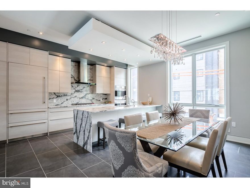 23.5 foot wide new construction, with Elevator, garage, 4 Decks including two Roof-decks, Smart-home tech system, and the most finely appointed details in the city. The Carriage house unit at Liberty Estates Townhomes has it all. The living room, dining area and living room has heated floors. The wide open and extra wide living area has a built in fireplace with stone ledge, and this magnificent space spills onto a rear tiled deck that will make you feel like you are in Miami. The kitchen is spectacular, with Sub Zero and Wolf appliances, custom Italian cabinetry, custom counter tops including a HUGE island with cascading waterfall stone edge and a custom floating ceiling with accent lighting. The extra wide, 23'+ wide floor plan allows for a huge dining area right next to the kitchen. The interior iron railing system continues throughout the home along an elegant Black Walnut wood staircase. The roof decks are equipped with a kitchenette with sink, fridge, stone counter and built in Viking grill. The private deck off the master suite, and the deck off the living room supply a ton of outdoor square footage, totaling over 900 Sq feet. All of the bedrooms have great space and have ample walk in closets and accompanying bathrooms with the finest Grohe and Kohler finishes. The full floor master suite has it all, a six foot Kohler soaking tub, heated floors, double vanity, glass tile shower, deck and huge closets. Each bathroom is unique and has only the best materials. The woodwork throughout the home is stunning- including the custom baseboards and solid wood doors t/o. This may be the most well thought out home in the city. Not one inch of space has been wasted. Come visit our 100% complete and ready to be lived in Model home. Still time to customize the other homes in the development. 10 year tax abatement pending!! These are selling fast, already have pending sales in the development.