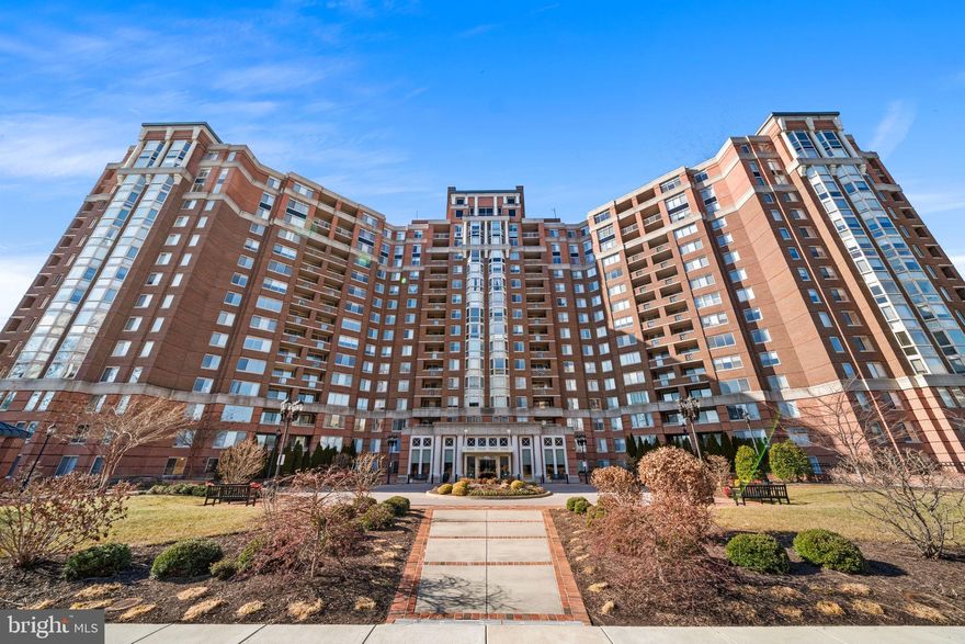 Open house cancelled - Welcome to the Wisconsin - one of the most sought-after, full-service buildings in North Bethesda. This fully updated, 2 bed / 2 bath unit is one of the rarest floorplans and sizes in the building. Enter the unit and find the remodeled kitchen on the left - complete with an expanded and leveled quartz island with extra storage below, new soft-close cabinetry, microwave, sink, and dishwasher. Hardwood floors throughout the main living and dining area, which opens onto a private balcony. Windows and privacy hedges allow for plenty of light to relax or work-from-home and the bump out is perfect for a full dining table or desk. The primary bedroom features a walk-in closet and additional closet leading to the updated, ensuite full bath. The second bedroom has ample closet space with direct access to the second full bath, which can also be accessed from the hall for guests. The unit includes dedicated garage parking (two tandem spots), a newer HVAC and washer/dryer. The Wisconsin is a gated community with a full clubhouse of amenities - including two full-sized pools (one indoor open throughout the year, and one outdoor for summer enjoyment), three full workout rooms for cardio and weights, an indoor racquetball court, an outdoor tennis/pickleball court, and club/party rooms. The spacious front courtyard, with its manicured lawns and elegant landscaping, is popular for relaxing walks and outdoor lounging. Full service front desk and updated lobby. Conveniently located near the North Bethesda/Grosvenor Metro station and bus lines, Pike and Rose, Whole Foods, REI, cafes and more, Strathmore Arts Center, Wildwood Shopping Center and many shopping centers for your daily needs. Easy access to major thoroughfares north in MD, or south in DC or VA.