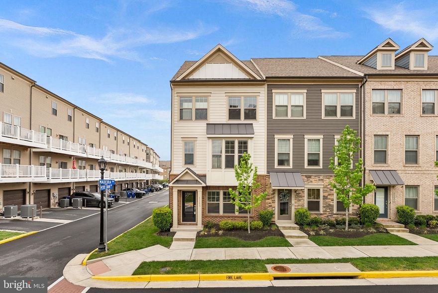 Why wait for new construction if you can have this like-new, end-unit townhome?! This 3 bed, 2.5 bath townhome spans across 2,000 square feet on an open-concept floorplan. This Jenkins model was built in 2020 and has plenty of upgrades. Walk into the spacious basement either through the front door or your two-car rear-load garage. The basement consists of a coat closet and rough-in for powder bath. Floors throughout the home, other than bedrooms, are complete with luxury vinyl plank flooring and oak stairs. Your large kitchen features a 9' kitchen island with quartz countertops, stainless steel appliances, upgraded tile backsplash, pendant lights, and plenty of cabinet space. The spacious dining room leads seamlessly to your low-maintenance deck with Trex railings for entertaining perfection, and here you will also find your half bath with upgraded pedestal and lights, and large, walk-in pantry.  Imagine relaxing in the airy family room with fabulous windows that allow for the natural light to soar through! The family room also consists of custom built-in's and floating wood shelves - perfect for extra storage and keeping your items organized. The third level features a primary bedroom suite with a walk-in closet with custom built-in's, a beautiful bath with separate vanities, frameless glass shower door, a stand-up shower with a bench and upgraded tiling in the bathroom floors and shower. The laundry room is located in the hall by the primary suite for convenience. Two additional bedrooms are located on this level and shared a hall bath with a tub. Community amenities  include a pool, tot lot, clubhouse, and plenty of walking trails. This home is not just beautiful inside, but the location is perfection! The W&OD trail is connected to the community, making this great for bikers and hikers, or for just taking your pooch for a walk. Right off of Route 7, this fabulous home is walking distance to The Villages of Leesburg and its shops, restaurants, and entertainment. Five minutes to Downtown Leesburg, a quick two minute drive to the Leesburg Outlets and shopping centers, and less than ten minutes to One Loudoun make this location ideal for you!