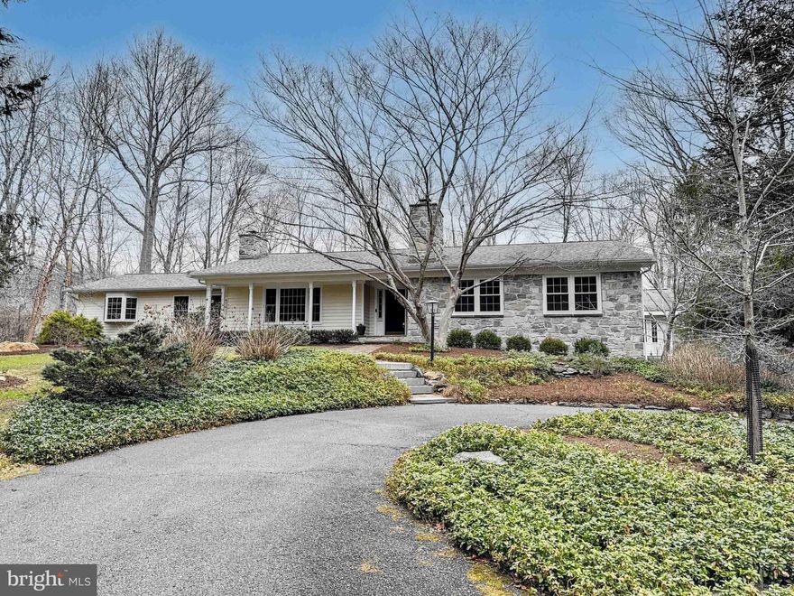 Welcome home to 1304 Old Forge Road in Oxford PA, a stunning custom stone ranch home nestled on 5.2 beautiful acres overlooking the Big Elk Creek. This warm and inviting home has been thoughtfully updated to include many high-end finishes and custom features which give it a casual, yet elegant feel. Highlights include a warm and inviting living room with hardwood floors, a beamed ceiling, built-in bookshelves and large picture window. French doors lead to the spacious dining room, with a large bay window offering beautiful views of the pool and woodlands to the rear of the home.  The custom kitchen was designed by Waterbury Kitchens in Chadds Ford and is a chef’s delight, with a 6-burner professional Viking Stove, upgraded SS appliances, a large island perfect for food prep and casual dining, highlighted by a large bay window offering beautiful views of the pool and rear patio area.  There is a private study with custom wood paneled walls and stone, wood burning fireplace, perfect for a home office or cozy den. The home was expanded by Cedar Knoll Builders to include the addition of a large “owners wing” which includes a private bedroom suite and spacious sitting room with vaulted ceiling, exposed stone wall and a large sliding glass door which leads to the pool area.   The primary bedroom has a cathedral ceiling, gas fireplace and bay window with yet another beautiful view of the pool. The ensuite bathroom and dressing area includes dual sinks and large closets, a separate bathing area with radiant floor heating, claw foot tub, walk around shower and water closet. Opposite the owner’s wing, there are two more spacious bedrooms, one with an ensuite bath and walk-in closet, and another with built-in bookshelves.  A renovated hall bath completes the right wing of the home. The finished lower level can be accessed by two separate staircases and includes a large rec room with wet bar/mini kitchen, (think circa 1980), a powder room, a spacious fitness room with tall ceilings  perfect for large gym equipment, and a home theater room.  The roof was replaced in 2023.  Outside, to the rear of the home, you will find a stunning Anthony Sylvan pool with an expansive multi-level deck with pergola, an outdoor fireplace and a beautiful cabana building with beamed cathedral ceiling and TV    perfect for outdoor entertaining.  For the home gardener and casual farmer, there is a large, fenced vegetable garden with raised beds and a custom hen house with running water. If you love to fish, simply walk the path through the backyard to the stocked Big Elk Creek and drop your line in! Make your appointment today, this unique and special home will not last long!