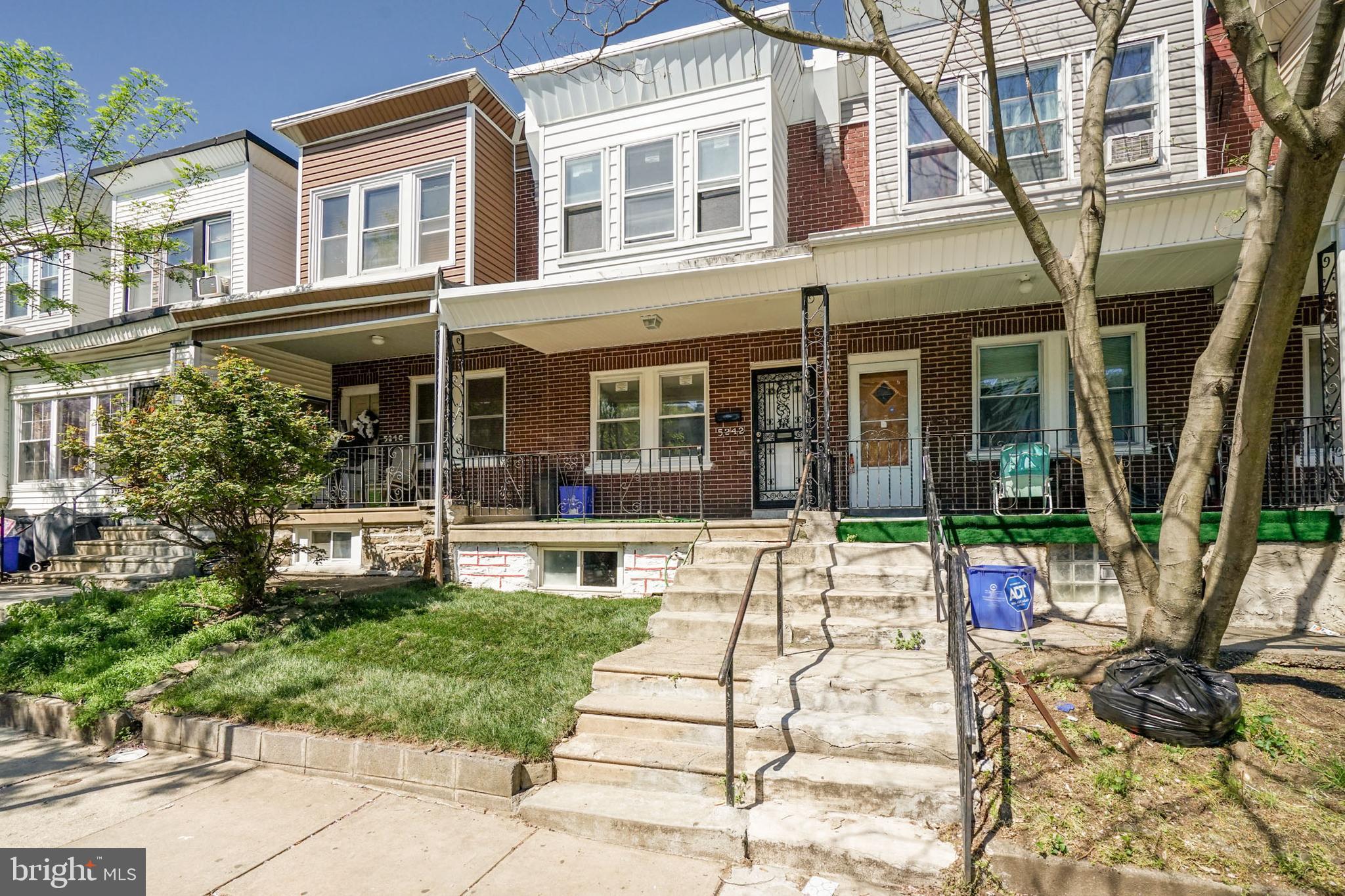 Completely renovated straight-thru situated on a quiet block in Olney. Arrive and you will immediately picture yourself relaxing on your covered front porch overlooking the newly sodded front yard. Enter to find fresh paint and beautifully refinished hardwood floors with herringbone inlays throughout. The main levels features a spacious living room with ceiling fan and new windows that provides an array of natural light, separate dining area with nice chandelier and leads to the dream kitchen complete with an abundance of new cherrywood cabinets with Quartz counters, ceramic tile floors & backsplash, all new stainless steel appliances that includes a 5 burner gas range and built-in microwave & dishwasher and provides access to the private rear yard. The upper level hosts 3 spacious bedrooms, all with ceiling fans and plenty of closet space, as well as the spa-like bathroom with soaking tub & shower combo with tiled surround, ceramic tiled floors and new vanity & toilet. The lower level is a full basement that can easily be finished into a family room or 4th bedroom and also hosts the separate laundry area with washer & dryer hookups. Additional features are 6-panel doors throughout, newer heater & electric service, replacement windows and the list could go on and on. Property is conveniently located near major highways, Olney and Fernrock train stations and several shopping centers. Will not disappoint.