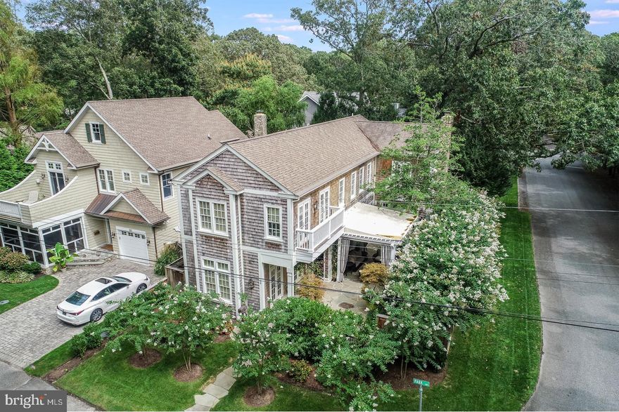 Palm Beach meets Rehoboth beach in this brilliantly designed custom North Rehoboth home.  This sought-after Park Avenue location offers complete privacy, little traffic, and parkland views from many angles of this stunning corner property.  Built by Garrison Homes with interior design by Palm Beach designer, Mary Lee Harper, this property is truly like no other in the surrounding area.  From the moment you enter, you will be in awe over the attention to detail at every turn.  This 4-bedroom, 4.5-bathroom residence was built in 2007 and has been gently used as a 2nd home since.  The property offers many luxury features both inside and out.  Upon entry you will find wide plank reclaimed hardwood flooring, custom built-in bench seating and cabinetry, exquisite Coffered ceilings and intricate moldings, surround sound, plantation shutters, phantom screens at all French doors, 2 fireplaces (1 gas / 1 wood burning) and a sophisticated floor plan.  Currently being used as a den, the first-floor bedroom serves as an ideal guest suite perfectly tucked away from all other bedrooms and living spaces and complete with a private en-suite bath.  This space offers huge windows overlooking the city park and access to the home’s charming courtyard.  The formal living room and family room also offer French doors with direct access to the courtyard creating the most intimate setting for entertaining.    The gourmet kitchen features a commercial grade Wolfe range, Sub-Zero fridge, beverage fridge, ice maker and prep island.   The keeping room off the kitchen offers a beautiful wood burning fireplace, perfect for Fall / Winter warming and ambience.  As you approach the 2nd level, you will enter into a room offering great flex space ideal for an executive office or sitting room.   This level also features 2 elegantly appointed guest bedrooms, laundry and a grand master suite that overlooks the home’s courtyard and parkland!  While the interior is exquisite, the outdoor living spaces are second to none!  Perfectly manicured landscaping contributes this home’s elegant curb appeal.  The flagstone side patio with a canvased pergola and working fountain sets the tone for pure relaxation.  The rear deck complete with grilling station and sink are perfect for summer barbecues.  The paver patio, privacy fencing and outside shower round out this home.  There are features too numerous to list.