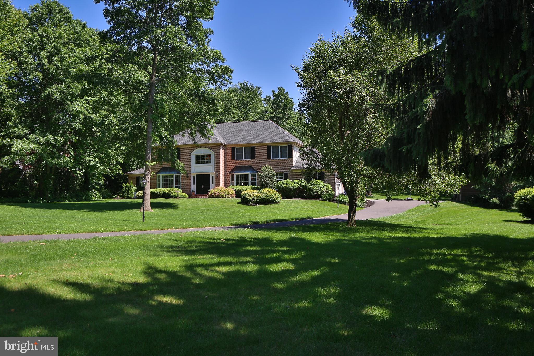 Welcome Home! This Breathtaking 4050 sq ft 4 Bedroom, 3.5 Bath Brick Estate home sits back off the street on a lush 1.47 acre lot. Enter this amazing property through the grand double doors to a sunlit entry way. On the first level, there is a spacious Living Room and Dining Room w/ crown molding and triple windows that offers an inviting Space to Entertain Guests.  The Gourmet Kitchen features premier brand Stainless Steel appliances, granite counter tops, over-sized island w/ seating, double sink w/ garbage disposal, an abundance of cabinet space, ceramic tile and an additional dining area w/ sliding glass doors that lead to the back yard. The Family Room includes rustic wood look tiled floors, fireplace with brick surround, recessed lighting, charming ceiling beams and two additional sliding glass doors that lead to the gorgeous patio.  Next to the Family Room, there is a huge Solarium w/ ceiling fan that can be used for entertaining, an exercise room and/or office space.  A lovely Powder Room and an updated Laundry Room complete the Main Level. The Second Floor has a large Master Suite w/ recessed lighting, ceiling fan, double door entry, and a FANTASTIC over-sized master walk-in closet with island storage and built in closet shelving! The Master Bathroom includes a dual vanity w/ extra cabinet space, ceramic tile surround, large stand alone soaking tub w/ air jets, ceramic shower w/ seamless glass door, skylight and recessed lighting. There are 3 large nice sized Bedrooms w/ spacious closets and ceiling fans w/ updated hall bathroom that completes the 2nd level.  A Finished Basement with full bathroom, recessed lighting and an additional room adds extra living space and storage. More interior features include: kitchen, master bath and upstairs hall bath all have programmable heated radiant floors, exterior doors were replaced with pained glass doors, newer front door, insulated garage doors with openers, and an added Bonus for Peace of Mind   A HOUSE GENERATOR comes included with the sale of the property!An in ground pool w/ fence, hot tub and Stamped Concrete Patio make for the Perfect Summer Living and a nice place to be quarantined while enjoying the view of both the Mature Trees and well Maintained Landscaping.  Septic System was just inspected and in great shape! Report will be supplied to buyer.  Home is located in Award winning Central Bucks West School District and is Minutes from Boutique Shopping, Museums, and Restaurants of Doylestown Boro.  Make Your Appointment Today to See This Beautiful Property!