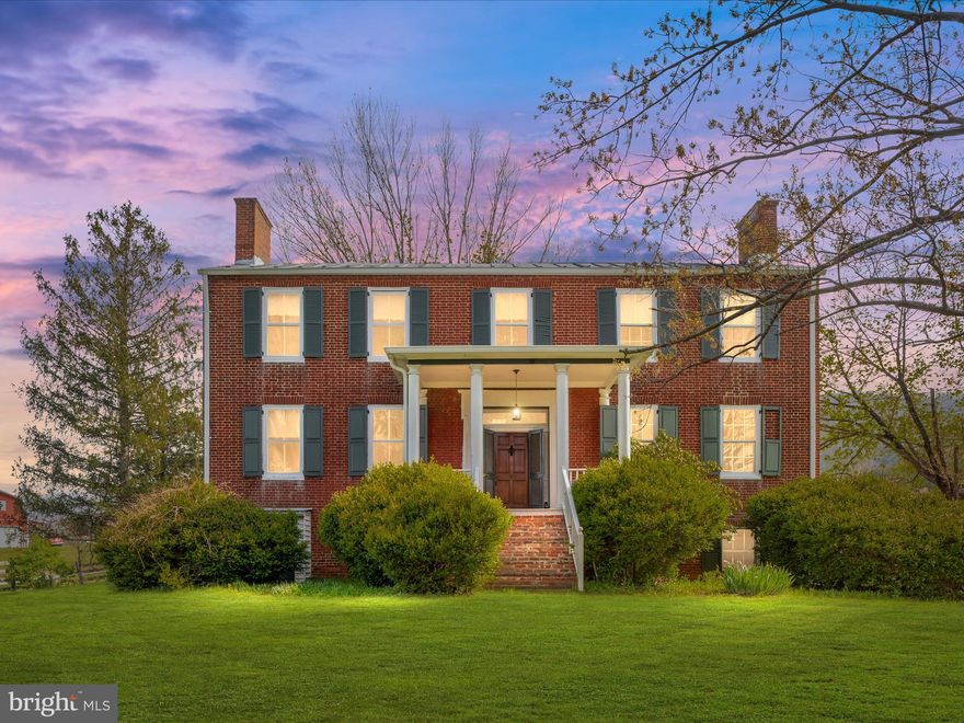 Step back in time with this stunning historic home, built in 1841. Liberty Hall is offering over 3,000 finished square feet of character and charm. Nestled on 2.51 acres, this all-brick beauty features four bedrooms, three full bathrooms, and an in-law suite on the lower level with interior and exterior access.

Inside, you'll find soaring ceilings, massive windows, and original hardwood flooring in select areas, filling the home with natural light and breathtaking views from almost every room. Built-ins are everywhere, and the formal living and dining rooms showcase five fireplaces—one operational—with historic mantles, including one reclaimed from an old ship. Built-in bookshelves, hidden closets in the lower-level bath, and ample storage add to the home's timeless appeal.  The floor plan is traditional; however, with the size of the rooms and floor plan, you can flow from room to room. 

The prominent eat-in kitchen features ample space, including a large island, breakfast area, and entertaining space, among other features, while the mudroom provides a practical entry space. A shutter door graces the front, and the sprawling covered front porch is the perfect place to relax. The home is completed with a tin roof for longevity and to enjoy on rainy nights! A cellar and partial basement provide additional storage and functionality.

Beyond the home, there is a fenced backyard with a shed, and the barn that includes a horse stall, hay storage, tack room (with electric) and two old silos, making this property ideal for equestrian enthusiasts.   Enjoy beautiful views of the countryside and the Shenandoah National Park!

Modern updates include 200-amp electrical service, copper piping, and a house generator for peace of mind.

If you're looking for historic charm and plenty of space, this one-of-a-kind property is a must-see!  Zoned ag and UNRESTRICTED!!!  PRICED BELOW CURRENT APPRAISAL!