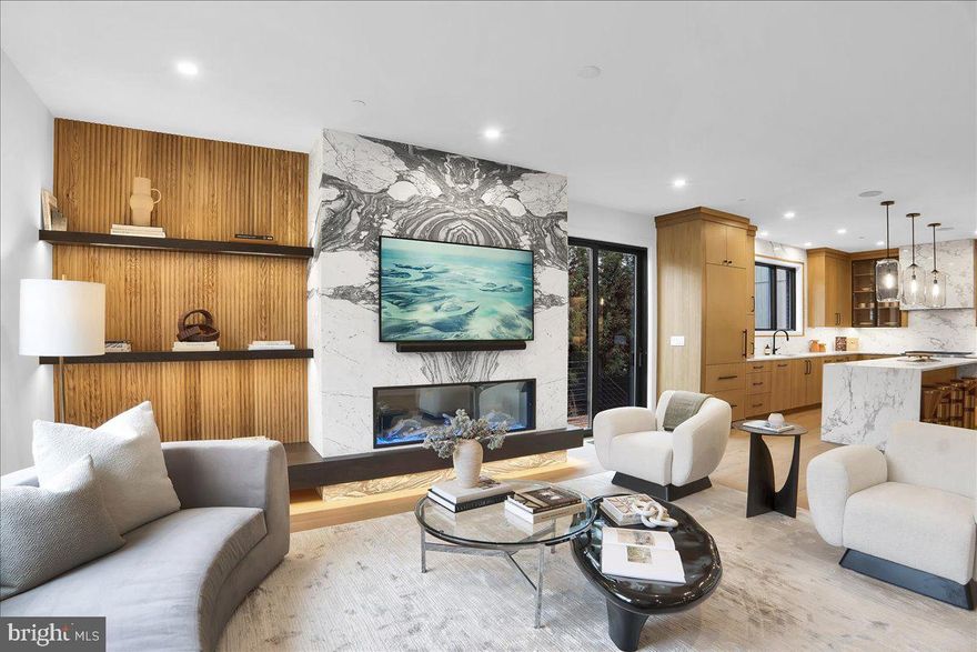 Luxury, location, and lifestyle converge in this exceptional New Hope residence, a luxury riverfront condominium by Barley Custom Homes that blends architectural character, refined design, and effortless turn-key living along the scenic Delaware River. Just steps from the heart of downtown, this striking home delivers an unparalleled experience where waterfront tranquility meets the vibrant energy of one of Bucks County’s most coveted destinations, all with notably low property taxes for the area and the convenience of three designated off street parking spaces.
The main level welcomes you with soft natural light and impressive versatility. Two spacious bedrooms provide comfortable retreats or the option to convert one into a chic, first floor office. A stunning gourmet kitchen anchors the space, featuring custom quarter-sawn white oak cabinetry, top-tier Wolf Sub-Zero appliances, sleek quartz countertops, sophisticated finishes, and expansive prep areas, ideal for both intimate evenings and elevated entertaining. The great room is centered around a striking marble-wrapped fireplace, creating a dramatic focal point for a warm gathering space.
Ascend to the third-floor primary suite, a showstopping retreat crafted with Barley Custom Homes’ signature attention to detail and design excellence. Soaring cathedral ceilings enhance the sense of volume and light, while river views envelope the space in a sense of quiet sophistication. The thoughtfully designed walk-in closet offers generous storage with refined elegance, and the spa-inspired bath features a sleek, oversized curbless shower that combines luxury with accessibility.
The expansive lower level elevates the home even further with thoughtfully appointed spaces for recreation and relaxation, contributing to the home's impressive approximately 4,425, sq ft of finished living space.  This level includes a full bathroom, a dedicated fitness area, a fashionable bar complete with a full refrigerator, and a custom wine room for the true enthusiast. Additional storage supports superior organization, while generous open areas provide flexibility for a lounge, studio, or media suite. Sleek modern garage doors, convenient interior access, and a whole-house generator add everyday comfort and peace of mind.
Savor direct river access ideal for kayaking, fishing, or quiet sunrise mornings by the water. With unmatched walkability to New Hope’s renowned boutiques, galleries, dining, and theaters, this residence offers the ultimate fusion of natural beauty, convenience, and refined living, a hallmark of the Barley Custom Homes experience.