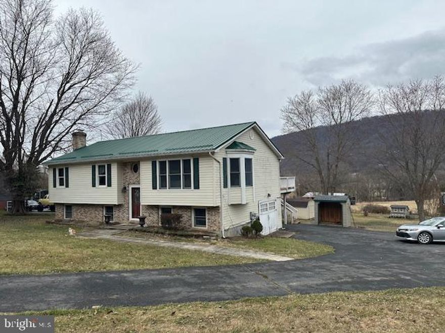 4 Bedrooms 3 full bathrooms 6 acre home with  awesome mountain views. Very nice kitchen with granite counters and hardwood floors. The best home and land in the county for this amazing price hurry. !00 percent loans. Very nice deck to enjoy the amazing views!!!3 very nice updated bathrooms.  Awesome lot1acrewide and6acresdeeplikeavery long football field !!!Awesome mountain views.  Their is a nice creek that runs through the back part of the lot fun for kids or if you have animals on the large lot or horses amazing the things you can do with this large home and huge lot to grow crops or farm!!!!