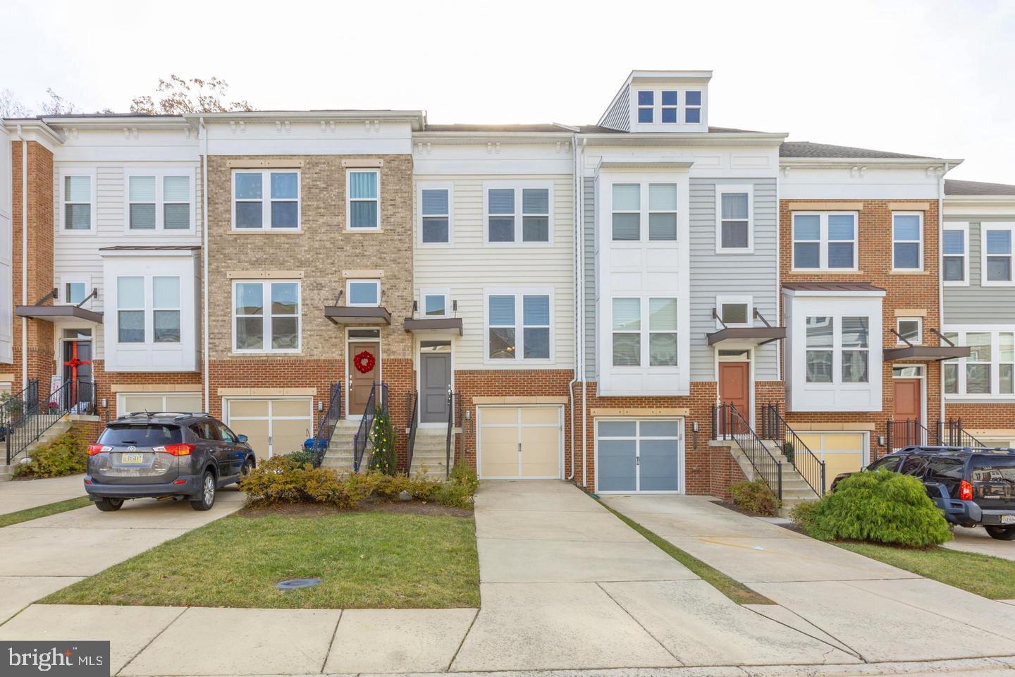 Welcome to 42669 New Dawn Terrace, a beautifully maintained 3-level townhome in the heart of Brambleton offering 3 bedrooms, 3.5 bathrooms, a one-car garage, and a fully fenced backyard. Step inside to a two-story foyer with hardwood floors and wainscoting, leading to a bright living room, formal dining area, and a convenient powder room. The gourmet kitchen features granite countertops, stainless steel appliances, pantry, breakfast bar, and hardwood floors, with a breakfast area that opens to a Trex deck—perfect for relaxing or entertaining. Upstairs, the spacious owner’s suite includes a walk-in closet and en-suite bath with a soaking tub, dual vanity, and walk-in shower. A second bedroom with its own private bath and a walk-out lower level with a third bedroom, full bath, and yard access complete the layout. Just minutes from Brambleton Town Center, this home offers access to pools, parks, trails, shops, restaurants, fitness centers, a movie theater, and more. HOA includes high-speed internet, cable, lawn care, trash, and snow removal, with convenient access to Dulles Airport and the Ashburn Metro.