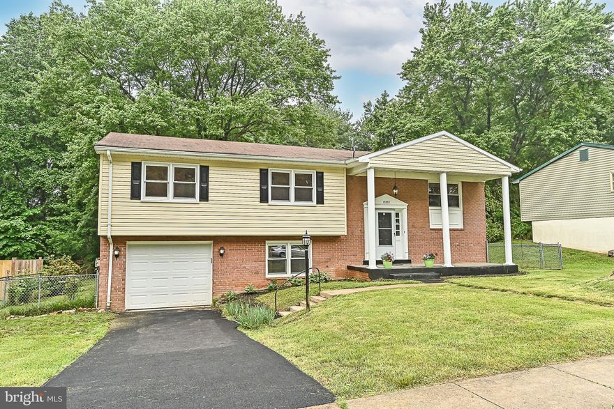 This lovely 4 bedroom, 3 bath home has been beautifully updated and offers plenty of living space on two finished levels. A tailored brick and siding exterior, 1-car garage and concrete driveway, stone front porch, vibrant landscaping, and a newly seeded backyard backing  and picnic area create instant outdoor appeal. Inside, a bright open floor plan, fresh on trend neutral paint, crown molding, updated lighting, fireplace on the bottom floor, hardwood flooring, and new carpet are just a few features that make this home so special.  A hot water heater, and recently serviced HVAC make it move in ready! A wide open entrance welcomes you upstairs into the light and airy living room with a beautiful wood flooring with a fine finish of  baseboard and  crown molding. The dining room with space for all occasions  and gives you that touch. The updated kitchen is sure to please with  a lot of cabinet and countertops space, upgraded lighting, fixtures and hardware, and stainless steel appliances and while glass paned doors fill the space with natural light and space for a table facilitates entertaining during meal preparation. New carpet  installed in all the bedrooms and into the light filled owner’s bedroom enjoying a private bath with a separate vanity area and a step-in shower. Two additional bright and sunny bedrooms share easy access to the well-appointed hall bath.  A spacious family room awaits on the lower level featuring a new flooring, a cozy fireplace set into a brick accent wall. Here, French doors grant access to the large yard  with a walkway to a patio and picnic area ...the perfect spot for entertaining family and friends and simple relaxation. Back inside, a fourth bedroom, a powder room, and laundry/utility room complete the comfort and convenience of this wonderful home.  All this in a peaceful residential setting in a fantastic mid-county location with no HOA and super convenient to Dale Boulevard, Prince William Parkway, Route 234, and I-95. There is plenty of nearby shopping, dining, and entertainment choices in every direction including Potomac Nationals Baseball Stadium, Prince William Forest Park, Potomac Mills, and Stonebridge at Potomac Town Center. It’s the perfect home in a spectacular location!