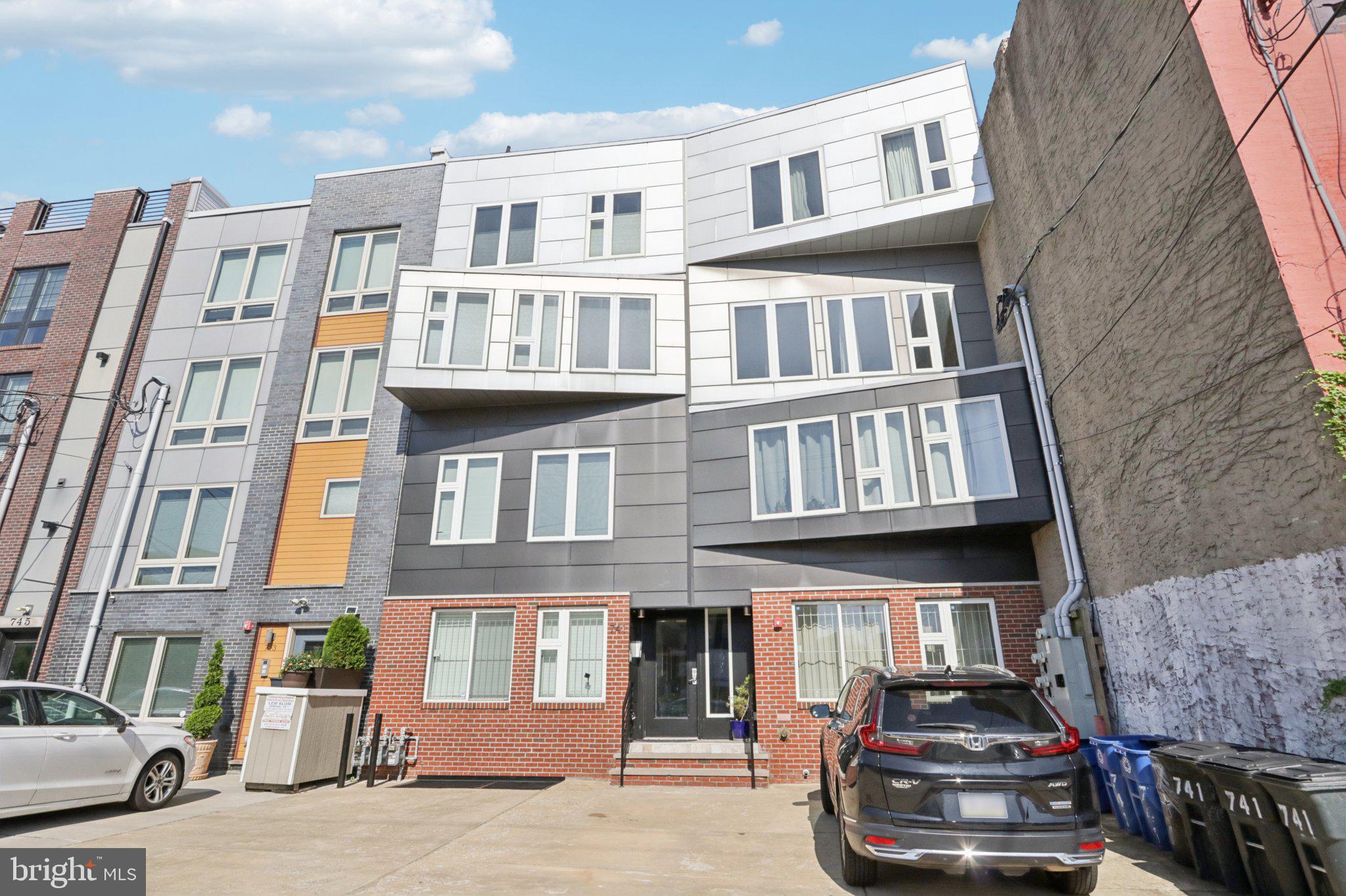 Welcome to this beautiful and sun-drenched bi-level condo nestled in the vibrant Francisville neighborhood! Enter into the inviting open-concept floor plan featuring gleaming wood floors that flow seamlessly through the entire unit. The spacious living and dining area is anchored by a stunning wall of windows that floods the space with natural light—perfect for relaxing or entertaining. The adjoining eat-in kitchen is a chef’s dream, complete with stainless steel appliances, a large island with seating, and an abundance of counter and cabinet space. Tucked at the rear of the main level, you’ll find a generously sized bedroom and a full hallway bathroom with a tub/shower combo—ideal for guests or a home office. Upstairs, you'll discover not one but two luxurious primary bedroom suites. The front suite boasts a full wall of windows, a massive walk-in closet, and a spa-like ensuite bath featuring a dual vanity and a glass-enclosed walk-in shower. The second suite, located at the rear for added privacy, also offers a walk-in closet and a sleek ensuite with a glass-enclosed walk-in shower. Convenience is key with a dedicated laundry area and extra storage on the upper level. As a bonus, residents enjoy access to a shared community rooftop with stunning city views—an ideal spot for lounging, entertaining, or enjoying a quiet evening sunset. Just blocks from Whole Foods, Penitentiary Park, and all the shopping, dining, and culture that Francisville and Fairmount have to offer. Don't miss your opportunity to own this light-filled gem in one of Philadelphia’s most sought-after neighborhoods!