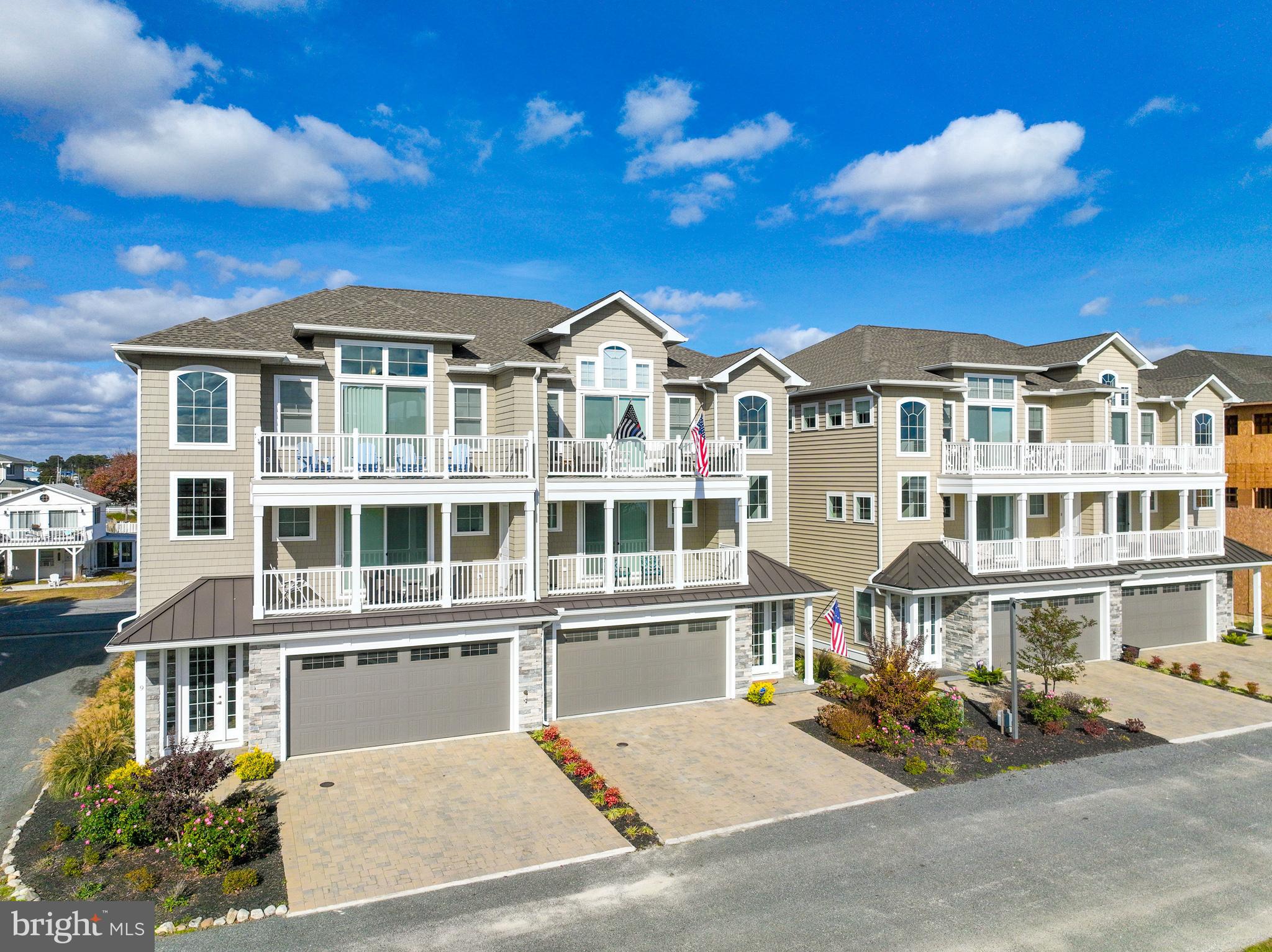 Welcome to luxury living in The Plantations, where elegance meets a serene coastal retreat. This newly constructed 3,130 sq. ft. townhome redefines coastal sophistication with expansive water views stretching across Assateague Island, the Atlantic Ocean, and the iconic Verrazano Bridge on the horizon. "The Plantations" symbolizes a refined haven inspired by coastal beauty and modern comforts.
This meticulously crafted residence boasts an open-concept design with custom built-ins throughout, enhancing each space with style and functionality. The heart of the home, an island kitchen, is a chef’s delight with high-end appliances, ample prep space, and seamless flow into the living and dining areas – perfect for entertaining or unwinding after a day by the shore. Featuring four generously-sized bedrooms, each with a private ensuite bath, this home offers privacy and luxury for family and guests alike. A well-placed half bath off the kitchen and living room area adds extra convenience. The primary suite is a sanctuary with picturesque views and spa-like finishes.
Accessible by a private elevator, this townhome ensures ease of access to all levels, including the spacious two-car garage. Combining luxury, convenience, and timeless coastal charm, this property at The Plantations invites you to experience the finest in beachside living. Now is the time to "Invest In The Beach Lifestyle".