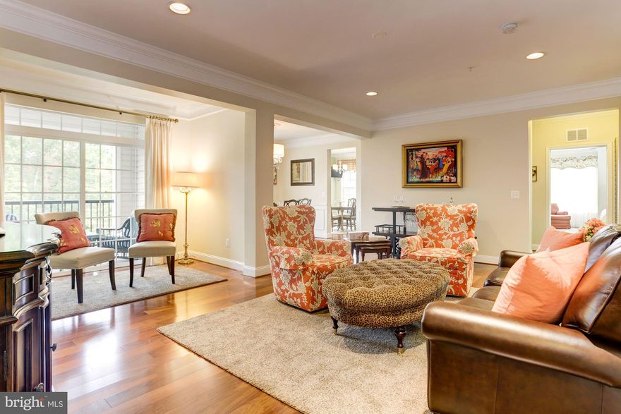 LUXURY LIVING:  1963 SQ FT PRISTINE 4 YEAR YOUNG CORNER UNIT;  3 BEDROOM 2 BATH CONDO INCLUDES DEEDED STORAGE UNIT!  SPACIOUS ROOMS OFFER GREAT FLOW FOR ENTERTAINING;   FEATURES INCLUDE:  STUNNING MASTER SUITE WITH LUXURY BATH; GOURMET KITCHEN, PANTRY,  BREAKFAST ROOM;  SUN ROOM WITH BALCONY;  LAUNDRY ROOM;  HARDWOOD FLOORS; CROWN MOLDING; 9'CEILINGS;   UPGRADES GALORE!  ENERGY STAR CERTIFIED;  INSIDE ACCESS TO PRIVATE GARAGE;  RESORT STYLE POOL, CLUBHOUSE, GYM, WALKING, BIKE, DOG PATHS,   ** NOTE - ONLY 1 BUYER NEEDS TO BE 55 YEARS OR OLDER. **  PET FRIENDLY