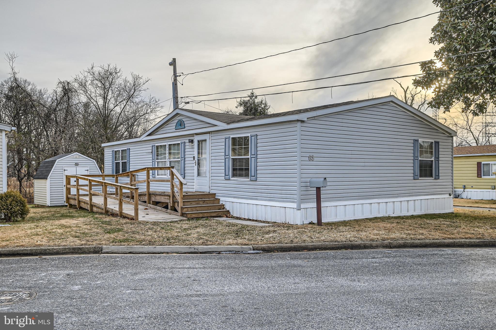Charming 3-Bedroom, 2-Bath Manufactured Home with Water Views! Nestled in a quiet and secluded setting within the Dundalk Mobile Home Court Community, this beautifully maintained home offers the perfect blend of comfort and convenience. Step inside to an inviting open floor plan with vaulted ceilings, creating a spacious and airy feel. The large living room flows seamlessly into the separate dining area and spacious kitchen, featuring plenty of cabinet space, a generous pantry, an island, stainless steel appliances, and a laundry room conveniently located off the kitchen. The spacious master suite boasts a large walk-in closet and an updated full bath with a walk-in shower, ample counter space, luxury vinyl plank flooring, and a newer glass block window that fills the room with natural light. On the opposite side of the home, you'll find two additional bedrooms, both with walk-in closets and a full bath, offering privacy and flexibility for family or guests. Step outside to a front porch, complete with a wheelchair ramp for easy access, where you can relax and enjoy the views right from your doorstep. In the rear of the home, you can unwind and take in the beautiful water views, creating the perfect peaceful retreat. A storage shed provides extra space for all your outdoor essentials. Conveniently located near major routes, shopping, and dining, this home delivers both comfort and accessibility. All appliances convey! All residents must obtain park approval through Dundalk Mobile Home Court. Monthly ground rent is $890.00. A perfect place to call home!