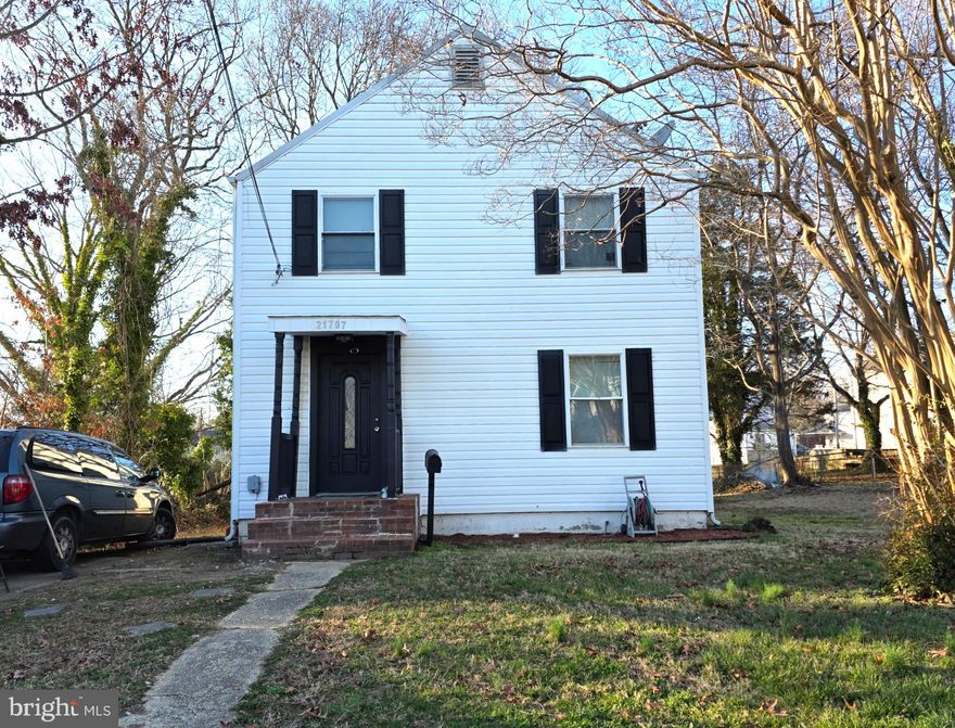 WOW! This  MOVE-IN READY, 4-BEDROOM, 2- BATH home is an INCREDIBLE VALUE, with a first floor addition making it Much LARGER  than most in the neighborhood!  Charming and WELL-MAINTAINED, this  home also offers numerous UPDATES including fresh paint, new carpeting and tile! ✨ Approaching the home, the front yard is  framed by picturesque mature crepe myrtle trees that burst into vibrant bloom each spring.  Brick steps lead up to the covered front entry porch, where a beautiful front door with sparkling leaded glass welcomes you inside. ✨ Step into the SPACIOUS living room that flows seamlessly into the bright dining room, with LAMINATE FLOORING throughout the main living areas. ✨ The REMODELED KITCHEN is a standout feature, offering newer ceramic tile flooring, countertops, cabinets, backsplash, appliances, and lighting! ✨THE FIRST FLOOR also includes TWO BEDROOMS, with tall ceilings and plenty of closet space, along with a  FULL BATH, refreshed with a new vanity top and flooring. ✨ Upstairs you’ll find TWO ADDITIONAL BEDROOMS, including an ample PRIMARY BEDROOM with an extra-large WALK-IN CLOSET/DRESSING ROOM—perfect for getting ready in style! The upstairs full bath has also been BEAUTIFULLY  RENOVATED AND ENLARGED. ✨ The  BASEMENT provides a LAUNDRY space with washer and dryer,  abundant storage space, and a semi-finished BONUS ROOM  that could be used as a home office, WORKSHOP or hobby space.  A  SUMP PUMP helps keep everything dry and provides valuable peace of mind. ✨ Outside, the SPACIOUS BACKYARD offers plenty of room for gardening, recreation, or simply relaxing, and a shed provides additional storage. ✨ ADDITIONAL UPDATES include:  WINDOWS (2018 & 2025), Water heater (2017), roof (2015), along with replaced toilets, sinks and light fixtures! ✨ Located in an established neighborhood experiencing ongoing REVITALIZATION, where many of these vintage homes continue to be remodeled and renovated. CONVENIENTLY LOCATED CLOSE TO the PAX RIVER NAS BASE and just minutes from shopping, dining, and everyday amenities, this home offers SPACE, VALUE, and LOCATION—SCHEDULE YOUR TOUR TODAY! ✨