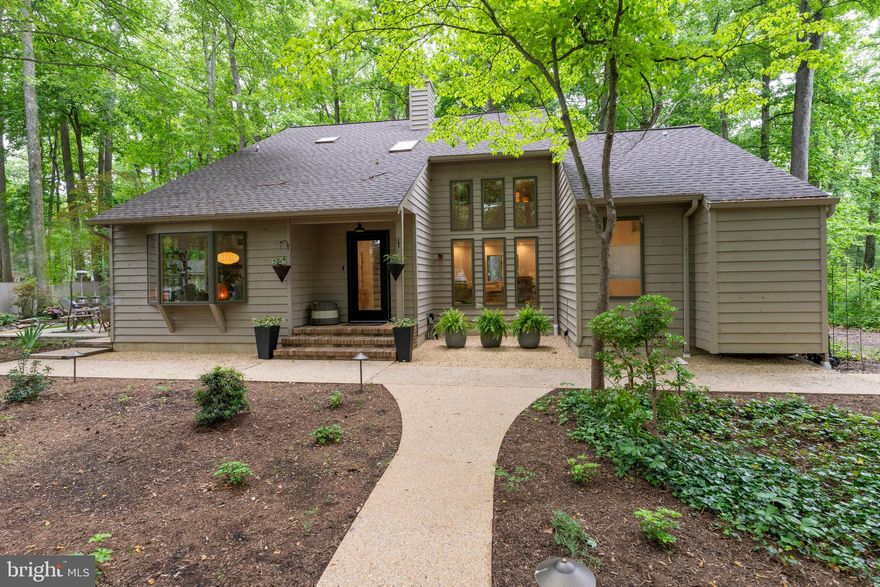 ***OFFER DEADLINE: Wednesday, May 22 at 12pm.*** 

SOUTH RIVER PRIVILEGED, WOODLAND CONTEMPORARY INVITING NATURE INDOORS!  Soaring ceiling and walls of windows framing ever-changing vistas of the vibrant seasons.  Enclosed porch, alfresco dining & grilling deck, and fire pit outdoor Living Room bordered by lofty shade tree canopies!  Open, deeply breathable spaces with organic textures, modern structural elements, upscale fixtures & detailing, engineered wood flooring, and turnkey neutral palette to enhance any décor!  2-story Living Room, Dining Room expanding onto porch, and on-trend crisp white Kitchen with stainless appliances, dining bar, casual dining area, and access to deck & yard.  2 Main level Bedrooms; Full Family Bath.  Upper loft level Primary BR retreat with private treetop balcony, Sitting Room, fabulous walk-in closet, luxury urban Bath, & Laundry.  Multi-vehicle driveway.  Cape St. John South River pier, boat ramp, playground, & picnic pavilion!  Minutes from Downtown City Dock, the USNA, Towne Centre & Westfield Malls, and commuter RTs 2/50/97/214.  HIGH-END TASTE & TRANQUILTY IN PERFECT HARMONY.