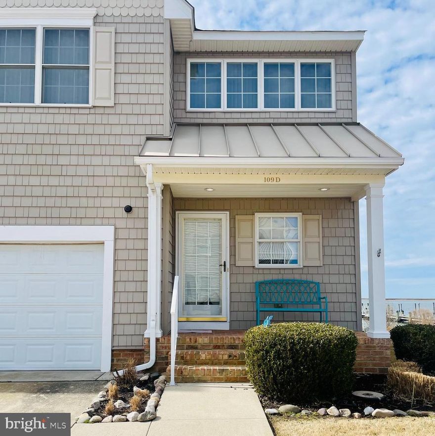 Wake up to wide, unobstructed water views in this spacious end-unit waterfront condo located in the heart of Crisfield. With 4 bedrooms and 3 full baths, this beautifully designed residence offers the ideal blend of comfort, functionality, and coastal lifestyle.

The bright, open main level features expansive windows that capture natural light and showcase stunning water views. A main-floor bedroom and full bathroom provide flexibility for guests, multi-generational living, or those seeking convenient first-floor access. Step onto the screened deck overlooking the water, perfect for morning coffee, evening sunsets, or entertaining with a view.

Upstairs, the generous primary suite includes a private full bath and its own balcony with panoramic water views. Two additional bedrooms and another full bathroom complete the upper level, offering ample space for family, guests, or a home office.

Outdoor enthusiasts will appreciate the attached garage and the included deep-water boat slip, ideal for boating, fishing, and exploring the Chesapeake Bay. Community amenities include a pool, private piers, sandy shoreline access, and beautifully maintained waterfront grounds.

Accessibility features include a main-level bedroom and full bath, wide interior spaces, and attached garage access, offering convenience and flexibility for a variety of living needs.

Located in the waterfront town of Crisfield, known as the Crab Capital of the World, residents enjoy local seafood restaurants, marinas, seasonal festivals, and waterfront events throughout the year. Nearby attractions include Janes Island State Park with miles of kayaking trails and wildlife observation. Ocean City beaches are approximately one hour away, and the property offers accessible commuter routes to Salisbury, Washington, DC, and Baltimore, making it suitable for a primary residence, second home, or investment opportunity.

Whether you are looking for full-time waterfront living, a weekend retreat, or a boat-ready getaway, this rare end-unit condo delivers space, views, and lifestyle in one exceptional package.