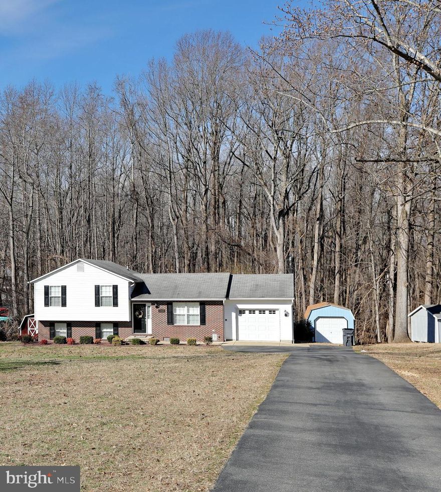 Beautiful & well maintained spacious split level home on over 1 Acre of ground, updated baths, kitchen, large screened porch off of the breakfast area. Garage has lots of storage & hanging storage shelves.  Lowe level has full bedroom, full bath, den & walk out. Large laundry area & storage room.
Upper level has 3 bedrooms, 2 full baths. Heat Pump replaced in 2014, Washer & Dryer almost new.
Owner works at home and has small children, please be mindful of their time when scheduling your appointment. Covid Protocols in place , Realtor & 2 adults ONLY on showings. No children please, Must have mask. Saturday OPEN HOUSE CANCELLED