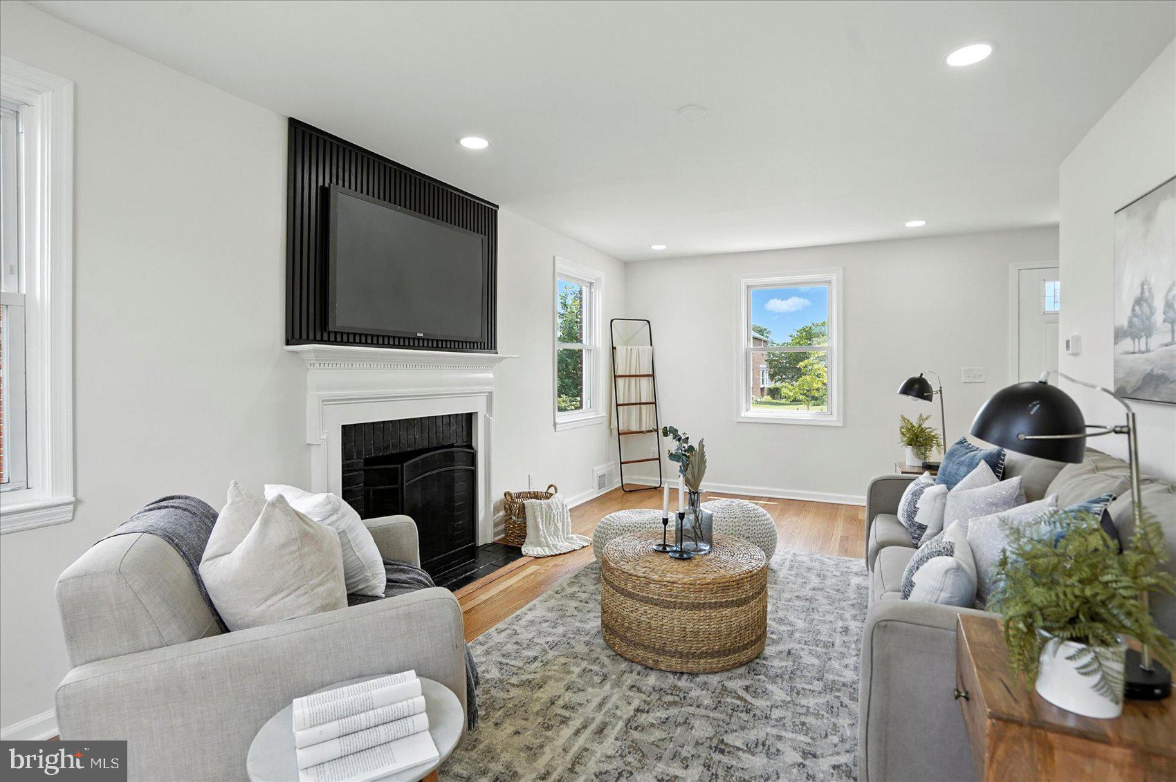 Welcome to this beautifully renovated 4-bedroom, 2-bathroom single-family home that combines classic charm with contemporary features. Gleaming hardwood floors flow throughout the main and upper levels, creating a warm and inviting atmosphere.
The updated kitchen is a true showstopper, featuring stainless steel appliances, sleek quartz countertops, gas cooking, and a spacious breakfast bar—perfect for morning coffee or evening cocktails. The living room offers a cozy retreat with a wood-burning fireplace, ideal for relaxing nights in.
Both full bathrooms have been tastefully renovated with modern finishes. The lower level expands your living space with a bright and spacious family room, an additional bedroom, and another full bath—ideal for guests, a home office, or multigenerational living.
Enjoy abundant natural light throughout the home and step outside to a large yard with plenty of space to play, garden, or entertain. A convenient parking pad completes this move-in ready gem.
Don’t miss this perfect blend of style, comfort, and functionality—schedule your tour today!