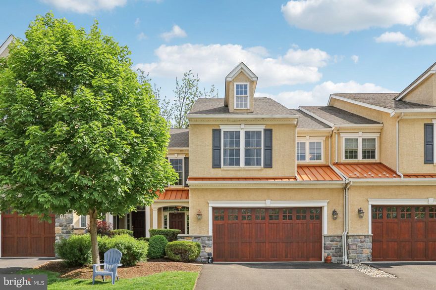 Rarely offered luxury townhome in the quaint enclave of Cold Point Manor. Experience three levels of sophistication and thoughtfully designed living space. The main level features 2 ¼’’ oak hardwood, three-piece crown molding, and Sonos hard-wire speaker system throughout. A spacious gathering room boasts cathedral ceilings and a gas fireplace with a custom-built mantel, opening up to a gourmet kitchen complete with stainless steel GE appliances, granite countertops, upgraded cabinetry, hot water dispenser and wine refrigerator.  A breakfast room and access to a maintenance-free composite deck overlooking a private view. A formal dining room with a stunning coffered ceiling, office/study with custom-built cabinetry, plus a half bath and access to the garage with electric car charger and California closet organization system completes the main level. A hardwood staircase leads to the second floor with two generously-sized bedrooms, laundry space, and a hall bath. The Owner’s Suite features an inviting sitting room, walk-in closet, and luxurious bathroom with an oversized frameless shower with two shower-heads, and a separate soaker tub. The lower-level has been perfected for the best of entertaining. A custom-built bar with sink, dishwasher, and space for an icemaker overlooks the built-in entertainment center with vent free fireplace, and an additional half bath.  A designated fitness area and storage room complete the lower-level. Recent updates also include new Roof (2024) and HVAC (2023). Don't miss this meticulous home in a great location- schedule your showing today!