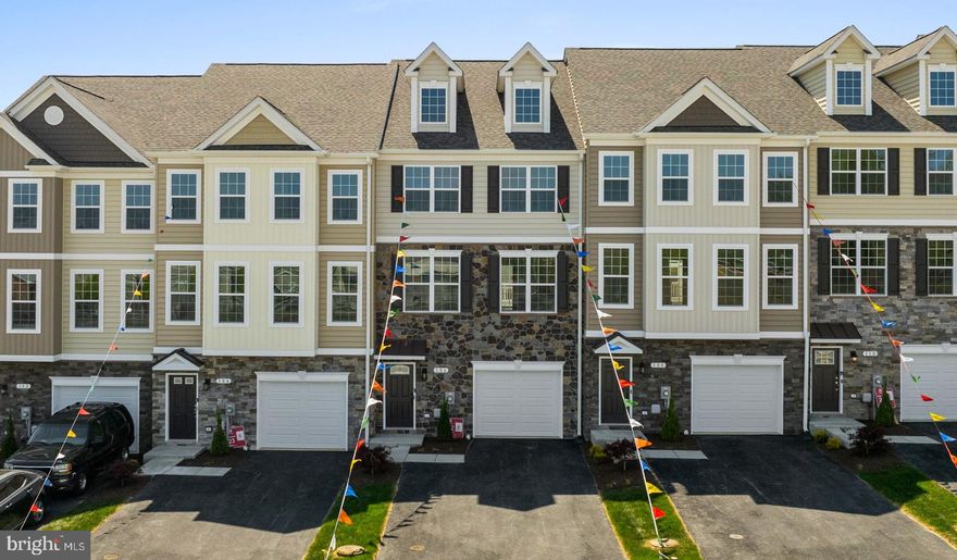 New construction townhome in the heart of Prince Frederick! Welcome to Phase 2 of Patuxent Commons, Prince Frederick’s newest townhome community offering immediate and early spring deliveries. This completed interior-unit townhome provides a great opportunity to own a brand-new home within walking distance to shopping, restaurants, the public library, ice cream shops, and other local conveniences.  This home features upgrades galore, including granite countertops in the kitchen, a deluxe shower in the primary bathroom, ceramic tile in all bathrooms, and luxury vinyl plank flooring throughout the kitchen, family room, dining area, powder room, and foyer/drop zone. Additional highlights include an oversized one-car garage, two-car-wide driveway, maintenance-free deck, and a fully fenced 6' vinyl rear yard with gate.  Patuxent Commons offers modern new construction with low-maintenance living in a convenient Calvert County location close to schools, commuter routes, and everyday amenities. This home combines stylish finishes, functional living space, and a prime location in the heart of Prince Frederick.  Builder incentive available: $12,500 in buyer closing cost assistance or a rate buy-down option with the use of the preferred lender and title company. Interior photos are from a recently completed similar home and are for illustrative purposes only. Actual finishes, materials, colors, and features may vary. Photos shown are not of the subject property.