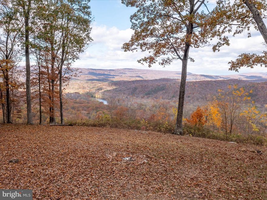 Sprawling 20.05 acres with magnificent views! Words, even pictures, do not do this view justice. Standing at the front of this property you are overlooking the Potomac River, the B&O Railroad, and the neighboring state of Maryland. The current owners lovingly named this property "Whistle Top" due to the southbound trains having to blow their whistle prior to entering the tunnel. When entering onto this property through the gate you will immediately notice the time and attention the current owners have put into the landscaping with strategically planted trees and bushes as well as the beautiful flowers that are about to come alive with the Spring season upon us. Not only does this property already have a well and electric run to the property, it also has a perc test on file with the Morgan County Health Department, and two storage sheds. Whether you are looking to build a full-time residence, a place in the mountains for family and friends to get away from it all, or maybe a perfect location for an Airbnb, this property is a must see!
