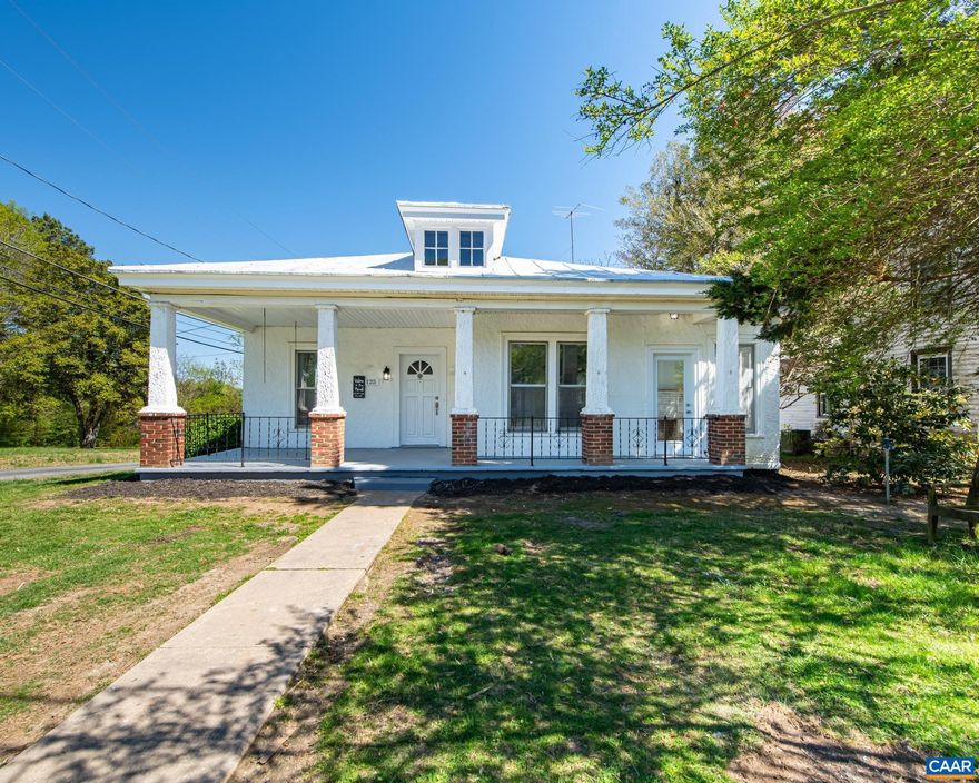 Welcome home to this truly unique and beautifully reimagined 1950s bungalow, less than one block from the park and the town of Louisa! From the standing seam roof and welcoming deep front porch to the wide foyer with high ceilings, this home offers a thoughtful blend of classic charm and modern updates.  The primary suite features a spacious bathroom with a tiled shower, walk-in closet, and a darling glassed-in porch?a true sanctuary complete with a decorative fireplace! Two additional bedrooms share a full hall bath with a tub/shower combo and a convenient laundry closet.  The open dining area flows into a large living room and the incredible galley kitchen, fully renovated with new appliances, cabinets, and granite countertops, while still showcasing original charm with a built-in corner cabinet.  The basement provides excellent conditioned storage. Outside, enjoy an oversized lot with a koi pond and a massive detached building (over 900 sq ft) offering great potential for a garage, workshop, or studio (structure will require some repair but ready for your vision!).  Location is excellent - just around the corner from the Louisa Town Park, and a short walk to town with easy access to shopping, dining, and local amenities.,Granite Counter,Painted Cabinets