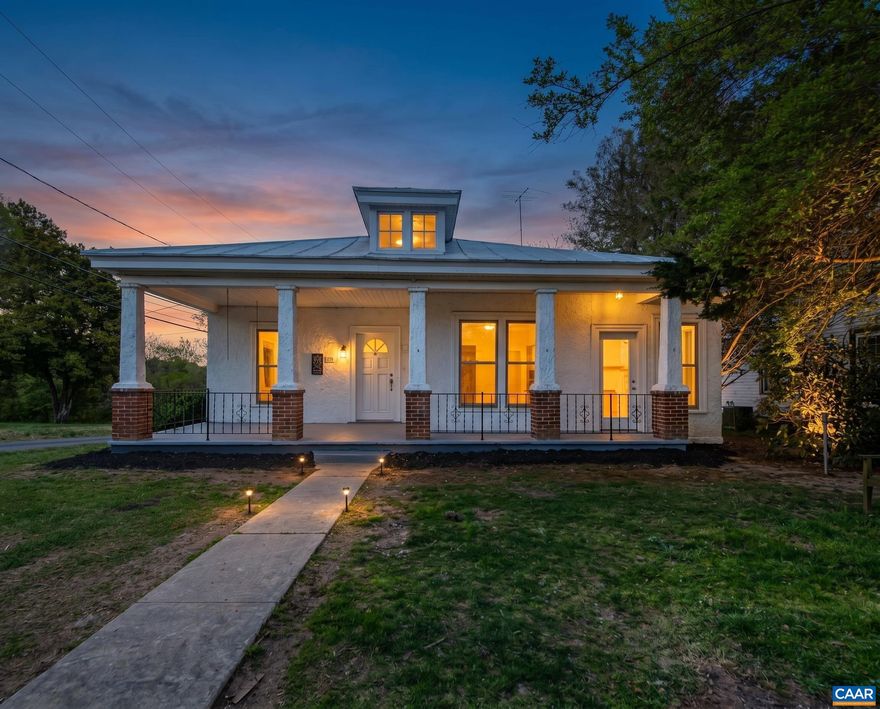 Welcome home to this truly unique and beautifully reimagined 1950s bungalow, less than one block from the park and the town of Louisa! From the standing seam roof and welcoming deep front porch to the wide foyer with high ceilings, this home offers a thoughtful blend of classic charm and modern updates.  The primary suite features a spacious bathroom with a tiled shower, walk-in closet, and a darling glassed-in porch?a true sanctuary complete with a decorative fireplace! Two additional bedrooms share a full hall bath with a tub/shower combo and a convenient laundry closet.  The open dining area flows into a large living room and the incredible galley kitchen, fully renovated with new appliances, cabinets, and granite countertops, while still showcasing original charm with a built-in corner cabinet.  The basement provides excellent conditioned storage. Outside, enjoy an oversized lot with a koi pond and a massive detached building (over 900 sq ft) offering great potential for a garage, workshop, or studio (structure will require some repair but ready for your vision!).  Location is excellent - just around the corner from the Louisa Town Park, and a short walk to town with easy access to shopping, dining, and local amenities.,Granite Counter,Painted Cabinets