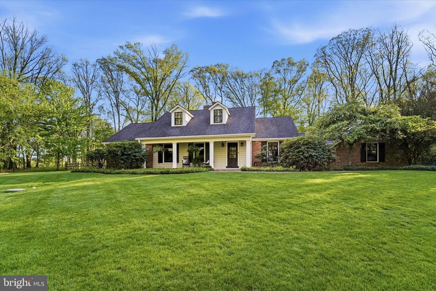 Experience ultimate first-floor living in this meticulously maintained Malvern masterpiece, situated on a lush, two-acre corner lot brimming with majestic dogwoods and vibrant greenery. This distinguished property is anchored by a highly sought-after first-floor primary suite, providing a tranquil escape with refined proportions and a stylish en suite bath. The interior shines with rich hardwood floors throughout and an exceptional floor plan with an open kitchen featuring custom cabinetry and Bosch appliances that flows seamlessly into the dining area through to the living room and into a sophisticated family room with a striking brick wood-burning fireplace. Transitioning outside, the home offers an extraordinary outdoor living experience, from the light-flooded all-season sunroom to the courtyard-style terrace to the expansive slate & brick patio featuring a wood burning stone fireplace. The second floor provides two additional bedrooms, a full bath, linen storage, and a versatile bonus room ideal for an office or studio, plus a walk-in attic with excellent potential for future customization. Added utility is found in the basement, where the unfinished side features recently painted flooring and ample workspace perfect for tools and handyman projects. Ideally located minutes from the Malvern train station, boutique shopping, and acclaimed dining, this home blends privacy with exceptional convenience. Notable features and upgrades include new chimney liners (2025), a new Trane HVAC (2023), Pella windows and doors (2017/2023), fencing (2013/2023), new driveway (2014), and a new roof (2013). This is an exceptional opportunity to own a sophisticated, turnkey home offering thoughtful improvements and a serene sanctuary in a premier Main Line location.